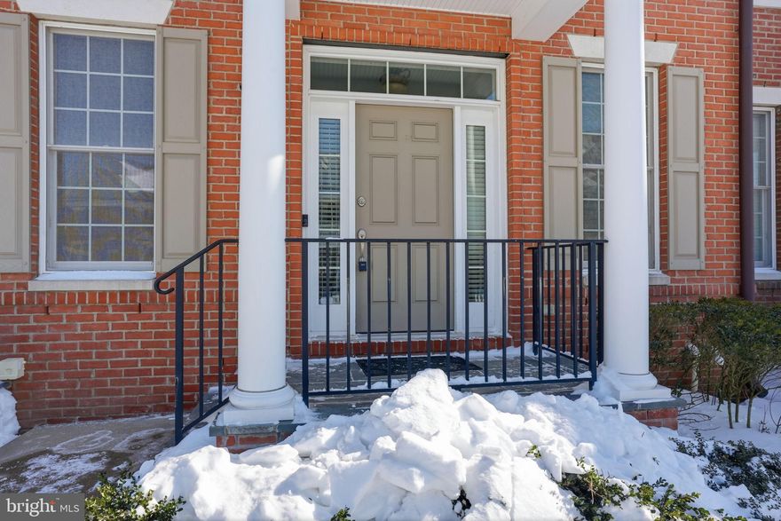 Set within the highly desirable Newtown Walk community, this impressive four bedroom townhouse offers the most expansive floor plan available and an outstanding opportunity for sophisticated, low-maintenance living. Thoughtfully positioned in the center of charming, Newtown Borough, the home spans three fully finished levels designed for both everyday comfort and effortless entertaining.

A bright, welcoming foyer opens to a stylish interior where rich hardwood floors anchor the open living and dining spaces. The heart of the home is the stunning, newly reimagined kitchen, beautifully appointed with a dramatic quartz waterfall island, custom cabinetry, statement backsplash, porcelain farmhouse sink, and a built-in 48" GE Monogram refrigerator. The adjacent family room exudes warmth and personality, featuring a gas fireplace, refined millwork, floating shelving, and integrated surround sound. Glass doors lead to the rear deck, creating a seamless indoor-outdoor connection ideal for gatherings or quiet evenings at home.

A rare and valuable feature of this layout is the main-level guest suite, recently refreshed and tucked into its own private wing, perfect for hosting visitors, multigenerational living, or a dedicated home office.

Upstairs, the serene Owner’s Suite serves as a true retreat with two walk-in closets and a spa-like bath complete with dual vanities and a soaking tub. Two additional generously sized bedrooms and a full hall bath round out the second level.

The third floor offers exceptional versatility and can function as a fourth bedroom, playroom, or secluded workspace. Below it all, the expansive basement with 9 foot ceilings provides remarkable additional space, featuring a cedar closet, rough-in plumbing for a future bath, room for a home gym, and plentiful storage.

Blending scale, style, and flexibility, this exceptional home is located in the award-winning Council Rock School District and just moments from Newtown’s popular dining, boutique shopping, cafés, salons, and top-tier fitness studios.