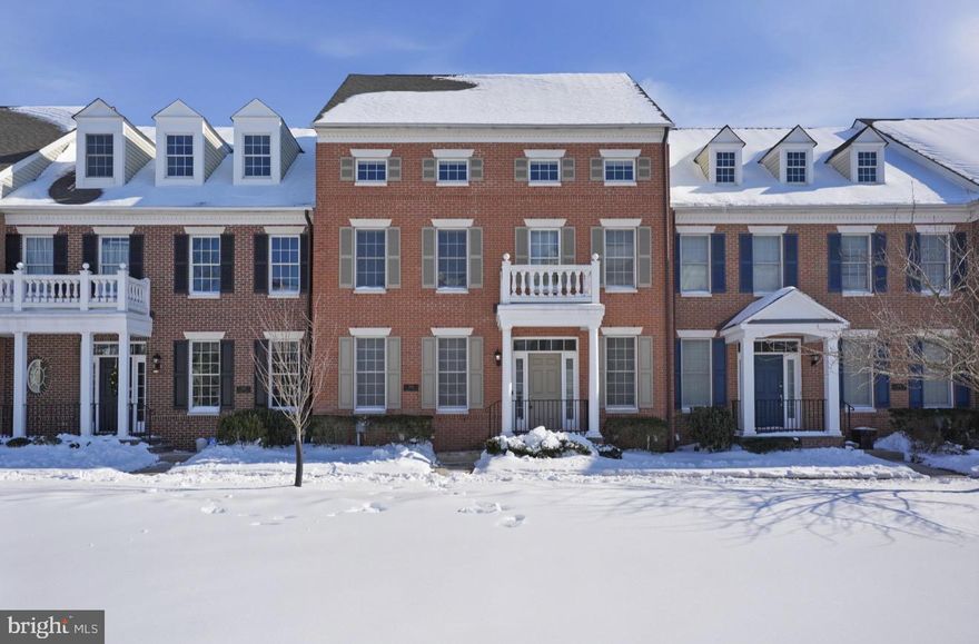 Set within the highly desirable Newtown Walk community, this impressive four bedroom townhouse offers the most expansive floor plan available and an outstanding opportunity for sophisticated, low-maintenance living. Thoughtfully positioned in the center of charming, Newtown Borough, the home spans three fully finished levels designed for both everyday comfort and effortless entertaining.

A bright, welcoming foyer opens to a stylish interior where rich hardwood floors anchor the open living and dining spaces. The heart of the home is the stunning, newly reimagined kitchen, beautifully appointed with a dramatic quartz waterfall island, custom cabinetry, statement backsplash, porcelain farmhouse sink, and a built-in 48" GE Monogram refrigerator. The adjacent family room exudes warmth and personality, featuring a gas fireplace, refined millwork, floating shelving, and integrated surround sound. Glass doors lead to the rear deck, creating a seamless indoor-outdoor connection ideal for gatherings or quiet evenings at home.

A rare and valuable feature of this layout is the main-level guest suite, recently refreshed and tucked into its own private wing, perfect for hosting visitors, multigenerational living, or a dedicated home office.

Upstairs, the serene Owner’s Suite serves as a true retreat with two walk-in closets and a spa-like bath complete with dual vanities and a soaking tub. Two additional generously sized bedrooms and a full hall bath round out the second level.

The third floor offers exceptional versatility and can function as a fourth bedroom, playroom, or secluded workspace. Below it all, the expansive basement with 9 foot ceilings provides remarkable additional space, featuring a cedar closet, rough-in plumbing for a future bath, room for a home gym, and plentiful storage.

Blending scale, style, and flexibility, this exceptional home is located in the award-winning Council Rock School District and just moments from Newtown’s popular dining, boutique shopping, cafés, salons, and top-tier fitness studios.