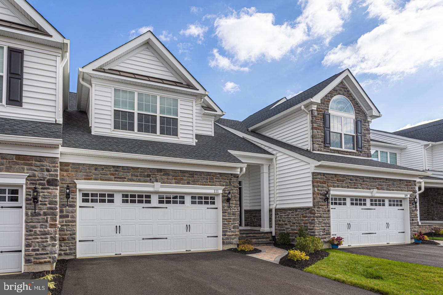 Welcome to 111 Lavender Dr and the vibrant 55+ community of Regency at Yardley! This gorgeous
Radcliffe model, built in 2021, has been rarely occupied by the current owners so you will see, it
presents as brand new. Stepping into the 2 story foyer from the covered front porch, the open concept
main floor offers an incredible combination of space, luxury and convenience. Fully open to the living
and dining rooms, the kitchen features a huge island with quartz countertop, space for breakfast bar
seating and abundant, gorgeous cabinetry. Stainless appliances, GAS cooktop and tremendous countertop
workspace make this kitchen as functional as it is beautiful. Adjacent to the kitchen is the large dining
area with plenty of space to create a more formal dining room atmosphere if desired. Both the kitchen
and dining area are fully open to and oriented towards the gracious living room with its GAS
fireplace and views towards the private backyard . Atrium doors access the nicely tucked in and maintenance free deck overlooking open community space and walking trails beyond. Also on the main floor is the wonderful primary bedroom suite. Situated at the back of the home, the primary suite features a modern and luxurious bathroom with oversized, ceramic tiled stall shower and double vanity. There is also a large walk-in closet and convenient direct access from the primary suite to the main floor laundry room with full work sink. . No need to worry about getting appliances delivered as the brand new washer and dryer are included. A powder room and inside access to the attached 2 car garage complete the main level. Upstairs you’ll find a wonderful, large loft with abundant recessed lighting that is ideal for work or play at home. The 2nd bedroom with it’s own walk-in closet and direct access to a full bath offers guests terrific privacy. The bath is well designed with access to the loft or to the bedroom. Additionally on this level of the home is approximately 500 Sq ft of finished space that, depending on the new owners’ needs , could be left as storage space or could serve a variety of uses. There is also a vast unfinished basement that offers another opportunity for the new owner to add finished living space as ceilings are high and there is rough-in for a future bath. As is, it’s wonderful. storage, workout and workroom area. Not only is 111 Lavender Dr a fantastic place to call home, the. Regency at Yardley community has a long list of amenities to offer. The newly renovated 12,000 sq ft clubhouse boasts a state-of-the-art fitness center, billiards and cards room, club and meeting rooms, a. tavern room, and more. There are heated indoor and outdoor pools, tennis and bocce ball courts, open. space and walking trails. The location is ideal, just minutes from Route 1, I-295, the PA Turnpike and. close to the charming Boros of Yardley, New Hope, Newtown and Doylestown. Low maintenance, luxury. living in one of Lower Makefield Township’s premier retirement communities awaits! Schedule your showing today.