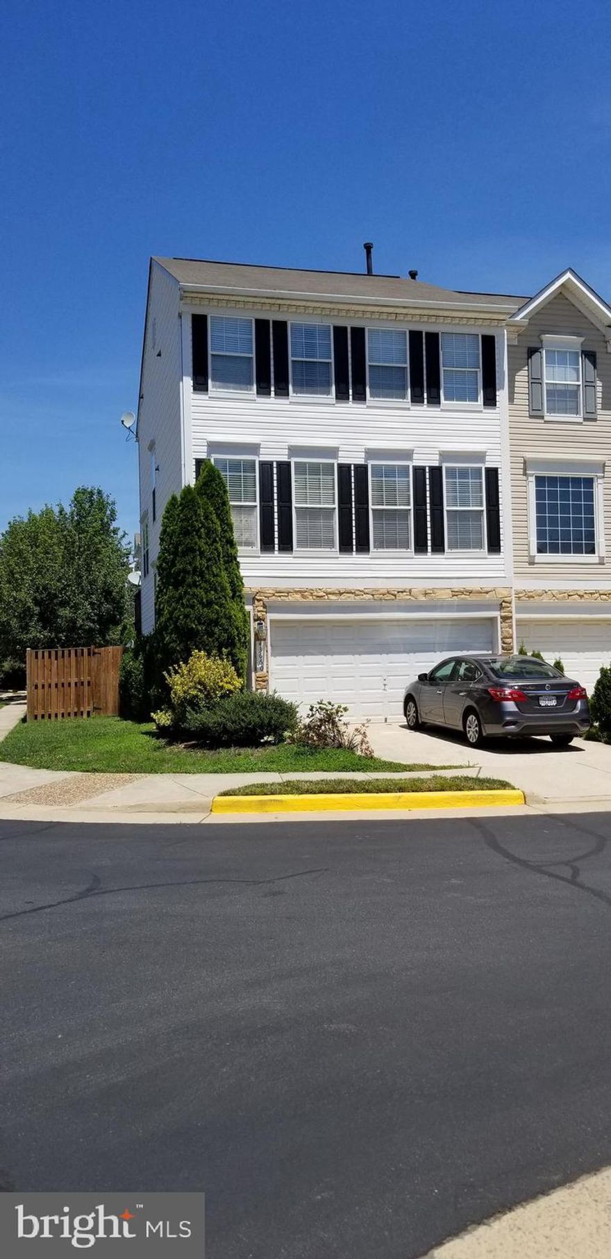 End unit townhouse with 2 car garage, 3 bedrooms, 3 full baths, 1 half bath, Stainless Steel appliances, wood floors and  and carpet.