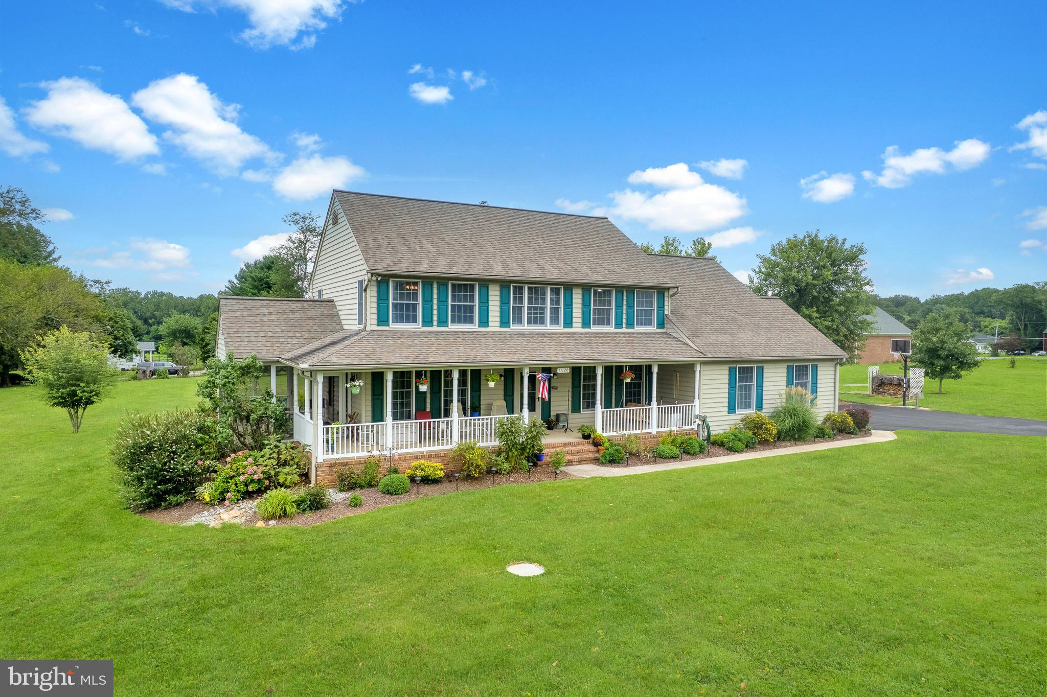 Set on 2 private acres in Owings Mills, this 4-bedroom, 3 full and 2 half-bath Colonial has been lovingly maintained by the original owners since it was built in 1997. A true highlight of the home is the wide, covered wraparound porch—a rare find and an inviting extension of the living space, perfect for relaxing, entertaining, or taking in the peaceful surroundings. Inside, the thoughtfully designed layout offers a spacious kitchen with a breakfast nook, a formal dining room filled with natural light, multiple living areas, a dedicated office, and a cozy free-standing wood-burning stove that adds warmth and charm. A screened porch off the dining area provides another great spot to enjoy the outdoors and the private backyard. Upstairs, the generous primary suite features dual walk-in closets and a private bath, while three additional bedrooms and two more full baths offer plenty of room to spread out. The unfinished lower level provides over 1,400 square feet of flexible space, including a secondary stairway with direct access to the garage for added convenience. Complete with an attached 2-car garage, an owned water treatment system, and a tranquil setting just minutes from shopping, dining, and commuter routes, this home perfectly blends privacy, character, and potential—don’t miss your chance to see it in person!