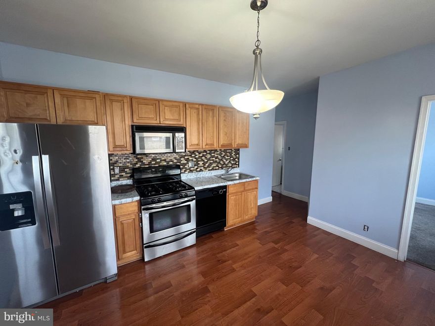 Welcome to this well-maintained first-floor unit offering comfort, convenience, and style. This 2-bedroom, 1-bath apartment features an updated kitchen with stainless steel appliances, including a refrigerator, microwave, and stove. Enjoy easy access to the shared washer and dryer located in the basement. With spacious rooms and a functional layout, this unit is perfect for comfortable city living.

Conveniently located near public transportation, all major highways, shops, and local amenities, this is a great place to call home!