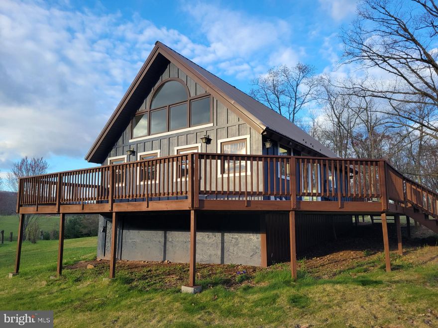 Leave the city and come to the serene and scenic land that is 3488 Hampshire Grade Road.  Almost 16 acres of farm and woodland surround the picturesque chalet style home.  Well water means no sewer or water bills.  Relax on the expansive deck while enjoying the sun setting behind the stunning Sleepy Creek Wildlife Preserve.  The oversized detached 30x23 garage with 10ft door (11ft ceilings) provides not only ample storage but potential workshop area with space leftover for vehicles.  A generous backyard allows you to grow your own flowers and vegetables in your own raised beds.  Luxury vinyl plank flooring on main level compliment the sleek stainless appliances, beautiful custom stained glass panty door and open floor plan.  Newly painted interior, new washer and dryer along with new window treatments.  Owner furnishes lawn service along with quarterly pest control inside and out.  A small canine will be considered, no felines please.  Enjoy the luxe, relaxing, country lifestyle you have been looking for at this lovely custom home!