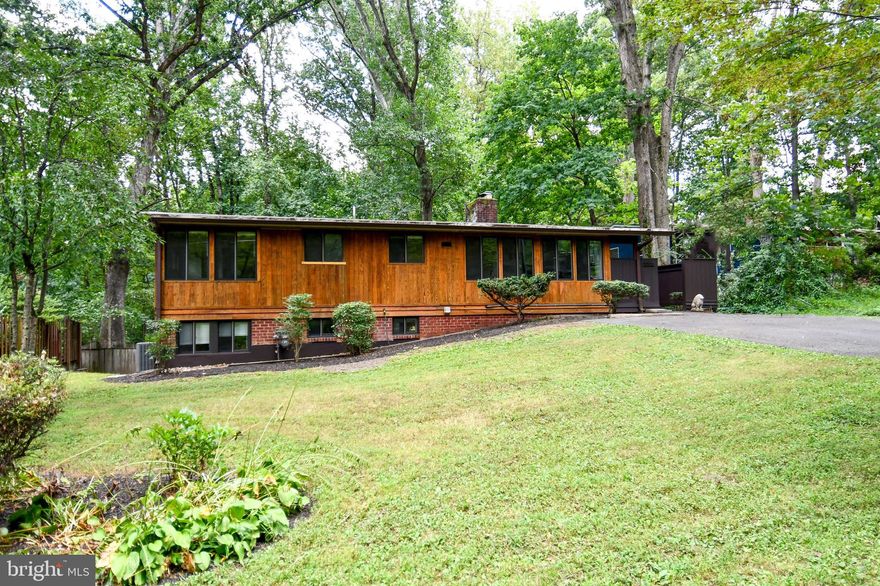 Fresh interior paint and hardwood flooring just refinished. Exterior siding & deck re-stained as well...Steps away from Luria Park and located on a culdesac that backs to the Stream Valley Parkland.  This gorgeous home features hardwood flooring on both levels, exposed wood beam ceiling, updated kitchen w/granite and stainless appliances.  Tons of windows/skylights to bring in the natural light! Expanded floor plan that features a foyer, separate dining room and a spacious living room with a wood-burning fireplace.  Lower level walk-out basement offers a finished rec room with wood-burning fireplace, 2 more bedrooms and a very generous full bath. New HVAC in 2024.

A truly special neighborhood that offers a rare combination of mid-century modern charm, community spirit, and convenient location.  Known for its distinctive mid-century modern homes designed in the 1950s, these homes feature clean lines, open floor plans, large windows, natural materials, and integration with the surrounding landscape. For fans of modernist architecture, it’s a dream neighborhood. Situated inside the Beltway, Holmes Run Acres provides easy access to major commuting routes (I-495, I-66, and Route 50), and is only minutes from the Dunn Loring Metro station. You can quickly reach Tysons Corner, Mosaic District, and Washington, D.C., while still enjoying a suburban, residential feel.