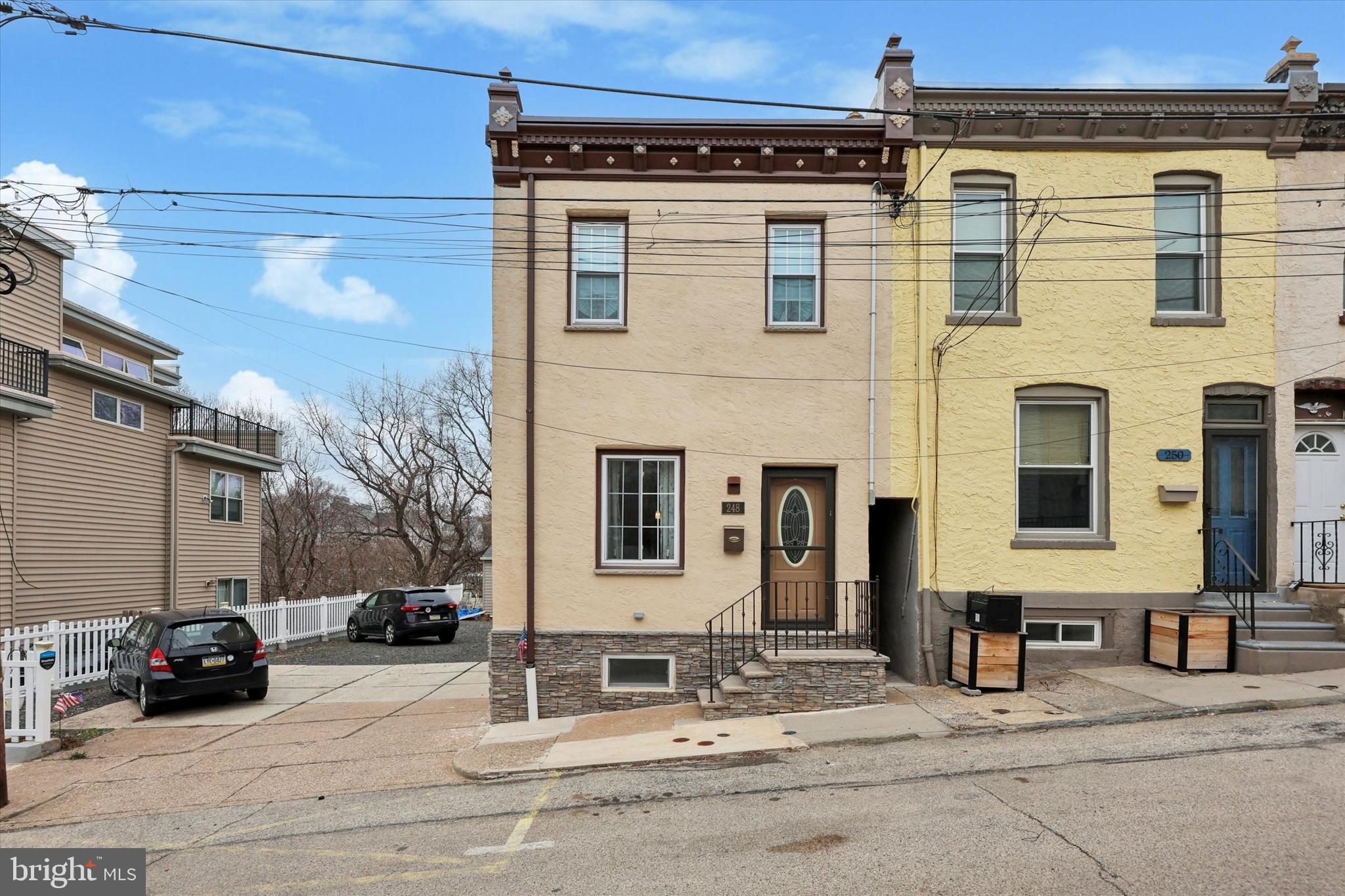 Rare opportunity in the heart of Manayunk! This charming 3-bedroom home is being sold as a package with the attached vacant lot, offering 6+ parking spaces—a true luxury in the area! Whether you choose to park, rent out the spaces, or create additional outdoor living, the possibilities are endless.
Meticulously maintained, this home showcases high-end features throughout, including a central vacuum system, tankless hot water heater, heated floors, central air, and beautiful hardwood flooring. The open-concept main floor flows seamlessly from front to back, leading to a spacious rear deck—perfect for entertaining. The finished basement adds valuable extra living space, while the upper level boasts three well-sized bedrooms and a large full bath with tub.
Tucked away on a quiet street with minimal traffic, yet just a short walk to Main Street Manayunk, this location offers the best of both worlds—convenience and privacy. Don’t miss out on this one-of-a-kind property—schedule your showing today!