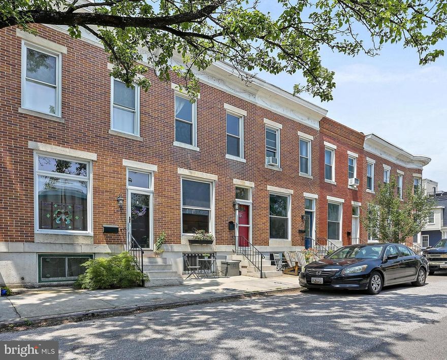 Welcome to this delightful three-bedroom rowhome nestled in the vibrant Riverside neighborhood! This spacious rowhome offers a thoughtfully designed layout that balances comfort with functionality.

Step inside to discover a bright living room featuring a large front window that floods the space with natural light. The separate dining room creates the perfect setting for entertaining guests, both spaces showcasing beautiful hardwood floors that add warmth and character.

The well-appointed kitchen is a home chef's dream with abundant cabinetry, a full-height pantry with roll-out drawers, and gleaming stainless steel appliances. The peninsula offers seating for three, complete with an under cabinet outlet for your appliances and clever storage solutions throughout.

Upstairs, three generous bedrooms provide comfortable retreats, while the full bathroom features practical built-in storage and a skylight that bathes the space in natural light. The lower level has a versatile recreation area, additional full bathroom with custom-built sink, and unfinished storage space with laundry facilities and built-in shelving.

Outdoor enthusiasts will love the oversized deck—perfect for grilling and al fresco dining. Parking is a breeze thanks to the dedicated one-car parking pad and plenty of additional spots available, as homes are only located on one side of the street. Smart home features include a fingerprint-sensor door lock, a smart thermostat, and a secure package locker for added convenience.

This isn't just a house, it is a lifestyle! Just steps from Southside Marketplace and beautiful Riverside Park, this townhouse offers the perfect blend of comfort, convenience, and walkability in one of Baltimore's most sought-after neighborhoods.