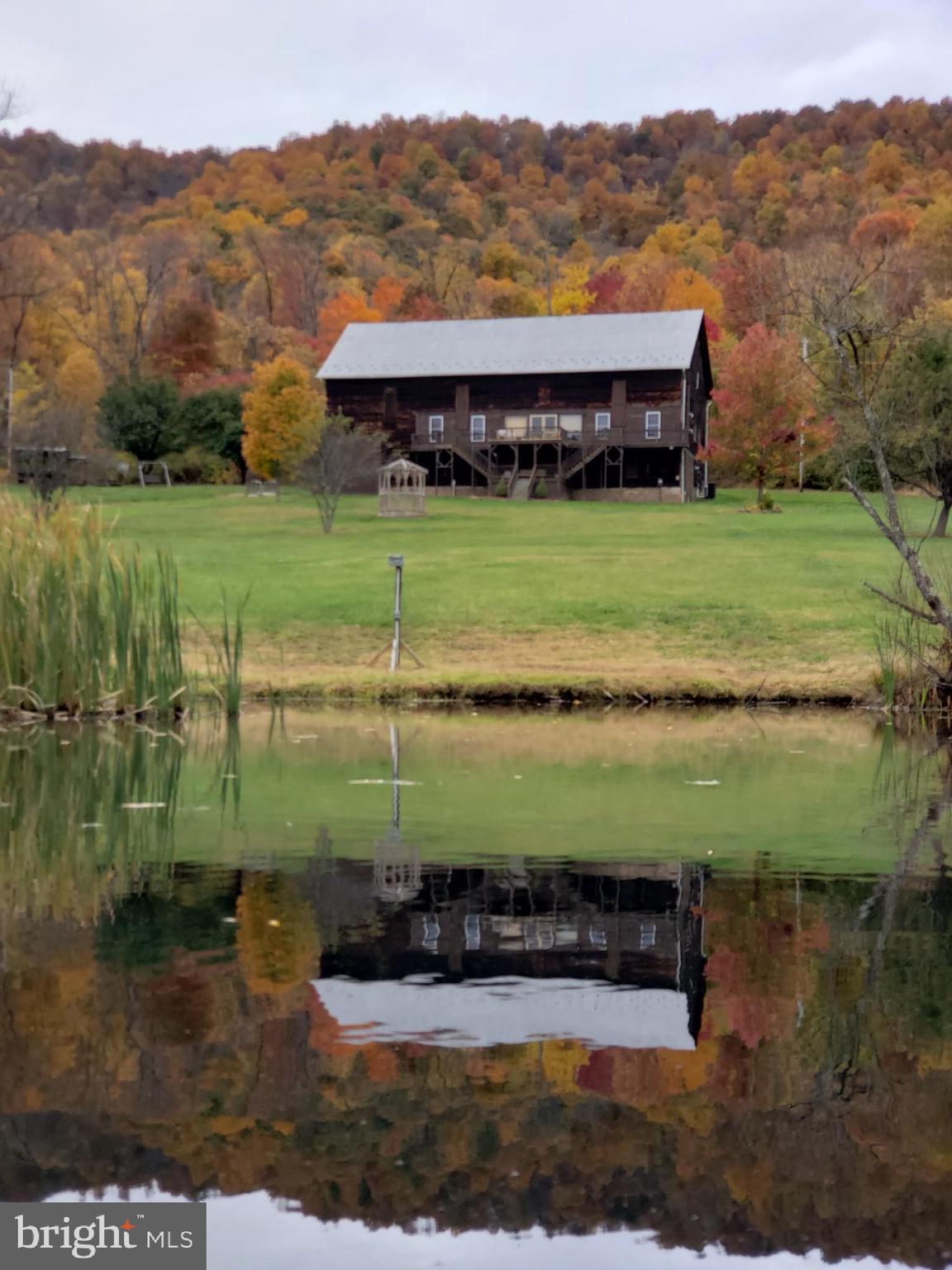 Bitter Goose Lodge – Turn-Key Investment Opportunity Near Lake Raystown, PA
Established hospitality business with over 20 years of loyal guest history, offering immediate income potential.
Nestled on 23 scenic acres in the heart of Raystown Country, the Bitter Goose Lodge provides both serene mountain retreats and exciting outdoor adventures. Surrounded by Pennsylvania's stunning Allegheny Mountains, this property features an expansive lodge, private cabins, and substantial event-hosting capacity, making it ideal for investors seeking a profitable and versatile business.
Property Highlights:
Main Lodge:
Spacious lodge sleeps up to 22 guests, offering a unique blend of rustic charm and modern comforts.
8 bedrooms (6 queen rooms, 1 twin room, bunk room)
Large country-style kitchen with modern amenities
Expansive living area with vaulted ceilings, electric fireplace, and wood-burning stove
Multiple decks with breathtaking mountain and valley views
Fully equipped kitchen and modern bathrooms
Four Private Cabins:
Each cabin comfortably sleeps 6 guests, perfect for families or smaller groups seeking privacy.
2 bedrooms (queen-size bed, twin bunk beds) plus queen pull-out couch
Fully stocked private kitchens
Air-conditioned, with cable TV
Private mountain-view decks
Amenities Included:
Sparkling in-ground swimming pool
Outdoor fire rings and picnic tables
Ample boat and trailer parking
Access to all 23 acres for hiking, wildlife viewing, and relaxation
Proven Revenue Stream:
With an established clientele and more than two decades of successful operations, Bitter Goose Lodge offers investors an immediate revenue stream. Its strong repeat-customer base provides stability and consistent annual income.
Event Venue Potential:
The lodge and grounds can comfortably accommodate events with up to 250 guests, offering significant income opportunities from weddings, reunions, to corporate retreats. The rustic charm and scenic backdrop make Bitter Goose Lodge a highly desirable event location.
Exceptional Location:
Minutes from Lake Raystown, renowned for boating, fishing, swimming, and water sports
Close proximity to Trough Creek State Park, featuring extensive hiking trails, picnic areas, and natural attractions
Easily accessible from State College (SCE) and Martinsburg (AOO) airports
Growth Opportunities:
Permits are in place for future expansion of additional cabins, allowing investors to further increase revenue and capitalize on high rental demand in this popular region.
Don’t miss this opportunity to own a thriving hospitality business with substantial growth potential.