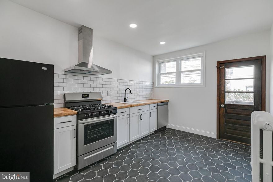 Pride of ownership is on full display at 3174 Miller Street. The main living space is anchored by a large south-facing window that allows natural light to pour in and cover everything from the high ceilings to the refinished original hardwood floors. Towards the center of the first floor is the open dining area, which provides a desirable amount of space to put on a record and enjoy a cocktail while hosting loved ones. Pass through the arched entryway to access the spacious kitchen adorned with butcher block counter tops, black hex tile floors, subway tile backsplash, and the continuation of natural light. The backyard is flanked by mature roses and hydrangeas, and offers an enclosed egress, ideal for city living. On the second floor is the 3-piece bathroom with stall shower, pedestal sink, and casement window. The middle bedroom is surprisingly large and can fit a king or queen bed with ease. At the front of the second floor is the massive primary bedroom, featuring an ideal amount of closet space and a generous footprint to furnish your sun-soaked oasis. 3174 Miller Street is within walking distance to Her Daughters Cafe, Campbell Square, La Roma, and all the local favorites found on Richmond Street.