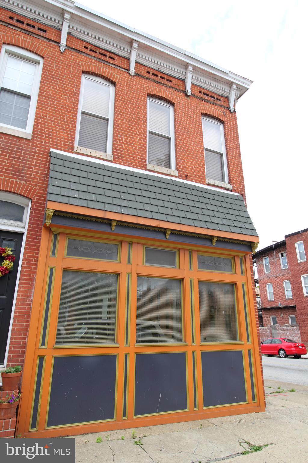 Once home to the historic Jungle Inn bar, this architecturally rich renovation is full of charm and character. Inside, you'll find soaring 10+ ft ceilings, random-width wood floors, original tin ceilings, wainscoting, custom stained glass, built-in bookshelves, exposed brick, and beautiful finishes throughout. The kitchen features granite tile counters, 42-inch maple cabinets, and black appliances.
The main level offers two bedrooms, including a primary with its own en suite bath. The second bedroom is smaller and could also make a great home office or guest space. The fully finished lower level provides a large open area—ideal for a media room, family room, or creative studio—and includes a second full bath. Rear parking for two cars is included. LANDLORD REQUIRES A MINIMUM CREDIT SCORE OF 680 PER OCCUPANT.
Available August 1st. Application fee is $75, due only upon lease acceptance. This fee is per lease (not per person). Tenants pay 2/3 of the building's total utilities which is billed by the Landlord each month.