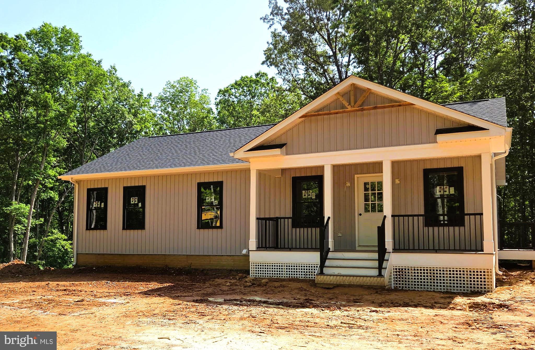Spectacular Custom Built 3 Bedroom, 2 Bath Rambler on 5.36 acres!! Eye catching vertical Board & batten siding, black frame windows, and so much more! Relax on the covered front porch and invite your friends to grill out on the Trex deck that spans the rear of the home. Kitchen features a breakfast bar and pantry, and the Breakfast Room offers plenty of table space! Spacious Primary Suite offers walk-in closet, private bath with double vanity. Rear deck can be accessed via both the Breakfast area and Primary Suite! Full, unfinished walk-out basement - a perfect canvas for your future rec room vision, or plenty of storage space!! Builder takes pride in using top quality materials and attention to details from start to finish! GAF lifetime architectural shingles, double-hung low-E black vinyl tilt-in windows, premium grade vertical board & batten siding, Trane high efficiency heat pump, Trex decking. Call about the opportunity to make your selections!