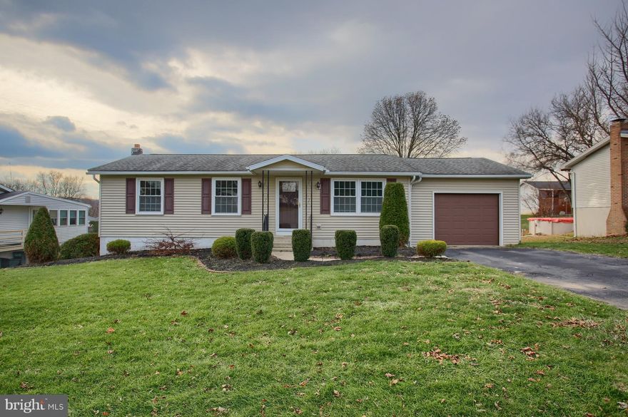 Your hunt for one floor living stops here in this cozy and meticulously cared for home. Enjoy many upgrades and improvements. The exterior is expertly maintained with clean, neat landscaping, newer roof and siding (both less than ten years old), replacement windows, new steel garage door and decorative front door, gorgeous 18 x 10 covered deck, and a level rear yard with mature shrubs. Step inside and fall in love! The eat-in kitchen renovation is stunning with 42" cabinets and crown molding, granite countertops, brand new Whirlpool appliances, new light fixture, ceiling fan, and a double sink. The central air conditioning was upgraded and replaced in 2006 as was the hot water heater in 2012. The lower level makes a fabulous second living area with over 500 square feet of additional finished space and walkout access. The bathroom floor and toilet have been replaced and the entire house boasts new shades and blinds. Should you be interested in the furniture, the seller says, "Let's talk." Don't let this house pass you by. Set up your showing today!
