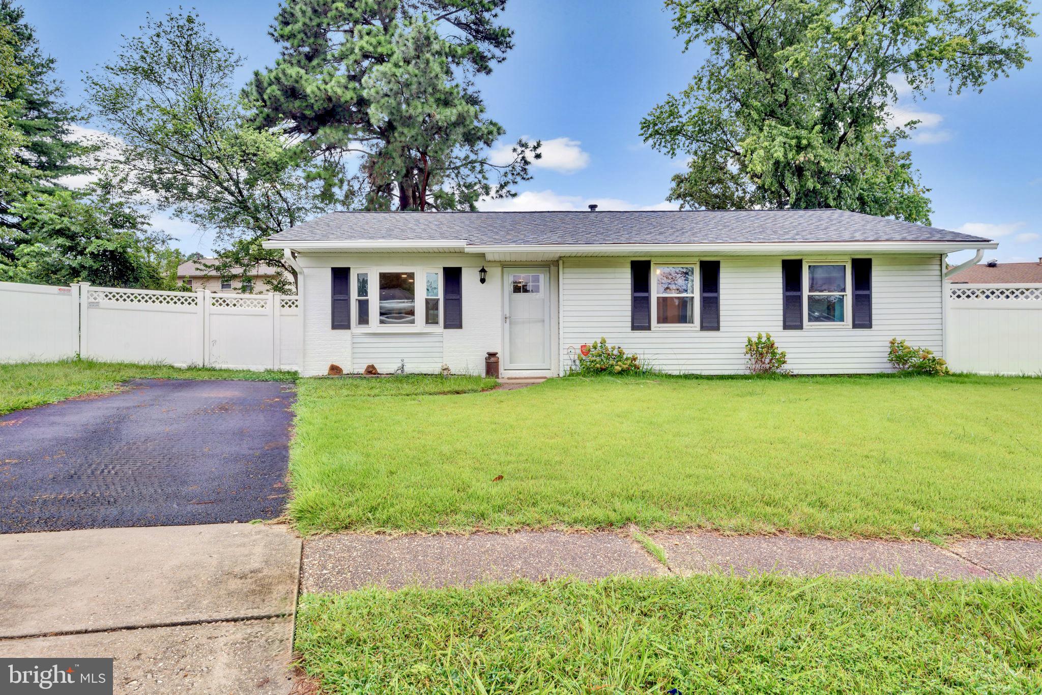 Beautifully updated and loved! Open floor plan with large kitchen island, plenty of room for preparing food and entertaining. The backyard is huge and fully fenced with maintenance free vinyl.