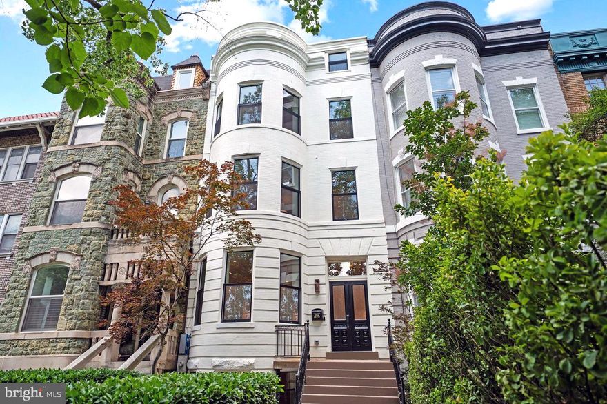 SOPHISTICATED ELEGANCE ON THE AVENUE OF PRESIDENTS

Originally designed by one of the most influential American architects of the late 19th and early 20th centuries, Glenn Brown, and completely renovated in 2025, this exquisitely renovated Victorian masterpiece by the award-winning Dilan Homes seamlessly blends timeless architectural charm with the finest modern luxuries. Positioned just off 16th Street, this 23-FOOT-WIDE residence offers an exceptional living experience, where every detail has been meticulously crafted for both style and comfort.

As you step inside, you're greeted by a grand foyer with striking HERRINGBONE HARDWOOD FLOORS that flow throughout the home. The spacious living room, bathed in natural light, boasts a beautifully designed WOOD BURNING FIREPLACE with custom built-ins—perfect for both intimate gatherings and larger entertaining. Just beyond, a thoughtfully located powder room caters to your guests, while the expansive dining area leads to your chef-inspired kitchen.

The gourmet kitchen is a true showstopper, outfitted with PREMIUM VIKING APPLIANCES—including a six-burner gas range and double-door refrigerator. The striking waterfall quartz countertops, paired with custom soft-close shaker cabinetry and sleek Brizo hardware, elevate the space to new heights of sophistication. The built-in cabinetry offers ample storage, a dedicated wine fridge, and a designated area for a coffee bar—ensuring your culinary pursuits are always supported. A second entry near the kitchen leads to practical rear storage, while the private flagstone patio awaits, offering serene outdoor living and the coveted luxury of TWO CAR PARKING.

On the second level, the primary suite is a true sanctuary, featuring a spa-inspired en-suite bath and a custom walk-in closet designed with custom lighting, shelving, and drawers—creating an ideal retreat for both rest and relaxation. This level also includes an additional bedroom, as well as a conveniently located washer and dryer, ensuring effortless convenience.

Upstairs, you'll find two additional bedroom suites, each complete with expansive closets and en-suite bathrooms. The baths showcase glass-enclosed showers and vanities adorned with Kallista hardware, blending modern style with classic design. A second washer and dryer on this level adds an extra layer of convenience.

The top floor presents an impressive bonus space that can serve as an additional living area, home office, or even an additional bedroom. This level also offers access to the private rooftop deck, an enviable space for outdoor entertaining or quiet reflection while enjoying sweeping city views.

The home's lower level provides a fully functional in-law suite, complete with a separate living area, kitchenette, washer dryer, full bathroom and a bedroom with a walk-in closet. Both interior and exterior access make this level ideal for guests or to be used as additional entertaining space.

Throughout the home, you'll find exquisite wide-plank hardwood floors, curated lighting by Visual Comfort, and hardware by EMTEK—elevating every detail. Located just two blocks from the dynamic 14th Street Corridor, enjoy unparalleled convenience with proximity to Trader Joe's, the Metro, and Meridian Hill Park. A short stroll brings you to celebrated dining destinations, including Le Diplomate and Barcelona, along with an array of shops and entertainment.

This exceptional home combines the best of historic elegance and modern luxury—truly a rare find in the heart of D.C.
