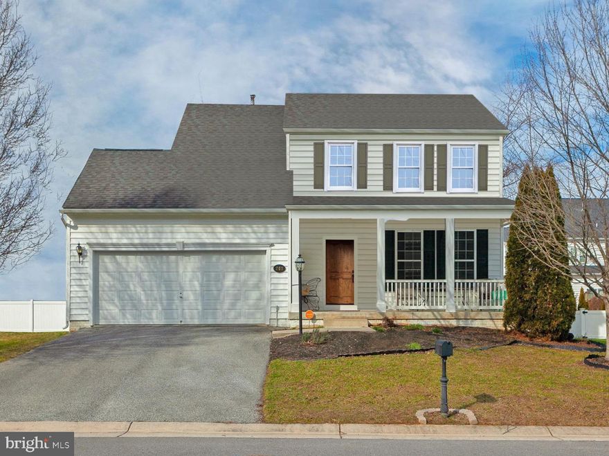 Situated in the desirable Villages at Washington Trail, this charming single-family home offers a seamless blend of comfort and elegance. Featuring three bedrooms and three and a half bathrooms encompassed within a spacious 2,800 square feet, the residence effortlessly achieves a harmonious balance between ample space and stylish design.  Stepping through the foyer you'll be greeted by warm hardwood floors that extend seamlessly into the kitchen and sunroom casting a radiant glow across the entire space. The large family room beckons with a gas fireplace creating a cozy ambiance and a perfect gathering spot. The main level boasts a versatile flex space allowing the new owners to customize and tailor the home to their unique needs. Upstairs, three well-appointed bedrooms await, including a spacious primary suite featuring with an oversized en-suite bathroom with dual sinks, a soaking tub, and a stand-up shower. The secondary bedrooms are generously sized complemented by another full bathroom. The finished basement adds an extra layer of entertainment with a recreation room and an additional full bathroom. Outside, a delightful backyard provides a serene escape for outdoor enjoyment. With its thoughtful design, abundant natural light, and flexible living spaces, this property is an inviting retreat for those seeking a place to call home.