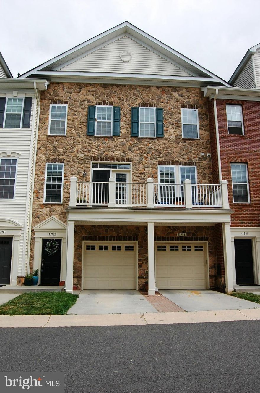 One car garage in a building that sides to trees & wetlands * Living room w hardwoods and ceiling fan * Kitchen w granite, black appls, maple cabinets, hardwoods & nook * French doors to the balcony * Laundry room * Powder room * Master suite with tray ceiling, ceiling fan, luxury bath and walk-in closet * Secondary bedroom with private bath * Loads of closet space *