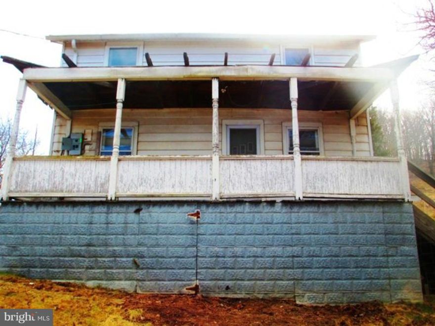 JUST REDUCED. If you don't mind getting your hands dirty and some hard work this might be what you are looking for. Handyman special with lots of potential.  This traditional 1900's Farm House sits on 4.65 rolling, cleared acres. No restrictions.  Property being sold "as-is".