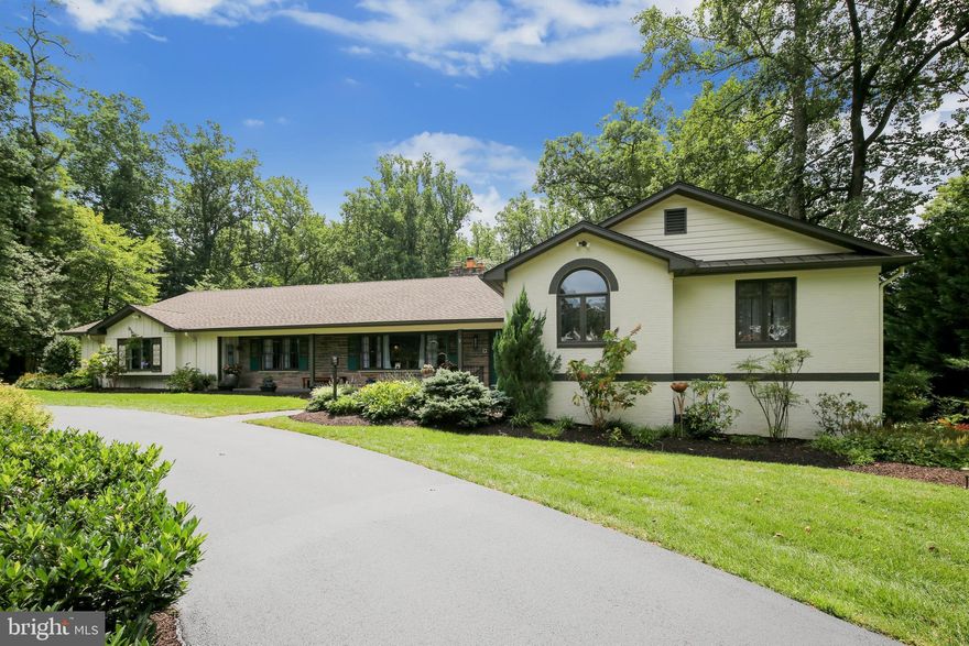 NOTE: Square footage from the tax records is incorrect.  As measured by TruPlace, the total square footage is 4,400 sq.ft.  Living is easy in this spacious, professionally renovated residence overlooking a backyard oasis in McLean's sought after Woodhaven neighborhood. This impressive home exudes modern elegance and invites the beauty of its natural setting inside through wall-to-wall windows and an open airy floor plan. Enjoy a one-of-a-kind fully renovated chef's kitchen, 5 bedrooms, 3 and 1/2 baths, abundant living space filled with high-end finishes and the joy of owning the perfect setting to relax or entertain.  Sited on a one-and-a-half acre landscaped and wooded lot in close-in McLean, this home has been thoughtfully expanded and renovated. The newly designed kitchen (2019) features a 13-ft quartz waterfall edged center island that seats 6-8 and opens to one of three patios overlooking a spectacular private back yard. Special features too many to list but include a top-of-the-line professional Miele 6-burner+griddle range with full oven, speed oven (microwave) and warming drawer, two additional wall ovens, a dual-zoned Miele wine chiller, stunning copper sink, pot filler and custom tile and cabinetry full of organizational surprises. All bathrooms updated with high efficiency eco accessories (2020).  Other highlights include LED lighting, built-in cabinets, two wood-burning fireplaces and hardwood floors throughout. Large master suite with luxurious bath and his/her walk-in closets. Three additional bedrooms up. Lower level offers a perfect guest suite, teen bedroom, office or workout room plus bamboo wood flooring, custom sun shades and blinds. Home has tons of storage, oversized two-car garage wired for an electric car charger, main-level laundry/mudroom and a lower-level craft room. Located minutes to Tysons Corner, downtown McLean, Springhill Metro, 495, 267, 66, GGW Parkway and convenient access to Dulles, Reagan National and BWI. Minutes to hiking at Great Falls & Riverbend parks and Scott's Fun Nature Preserve.  Don't miss this rare gem, it is truly one of a kind! view the Virtual Tour Here: https://youtu.be/0gYppz3HzL8 Hot water heater installed 2013 with Gundy water circulator added in 2015 (faster hot water), furnace installed in 2007, 1500 gal. septic tank (dual system) with 2 distribution boxes complete replacement $38K in 2009, Roof 2009.