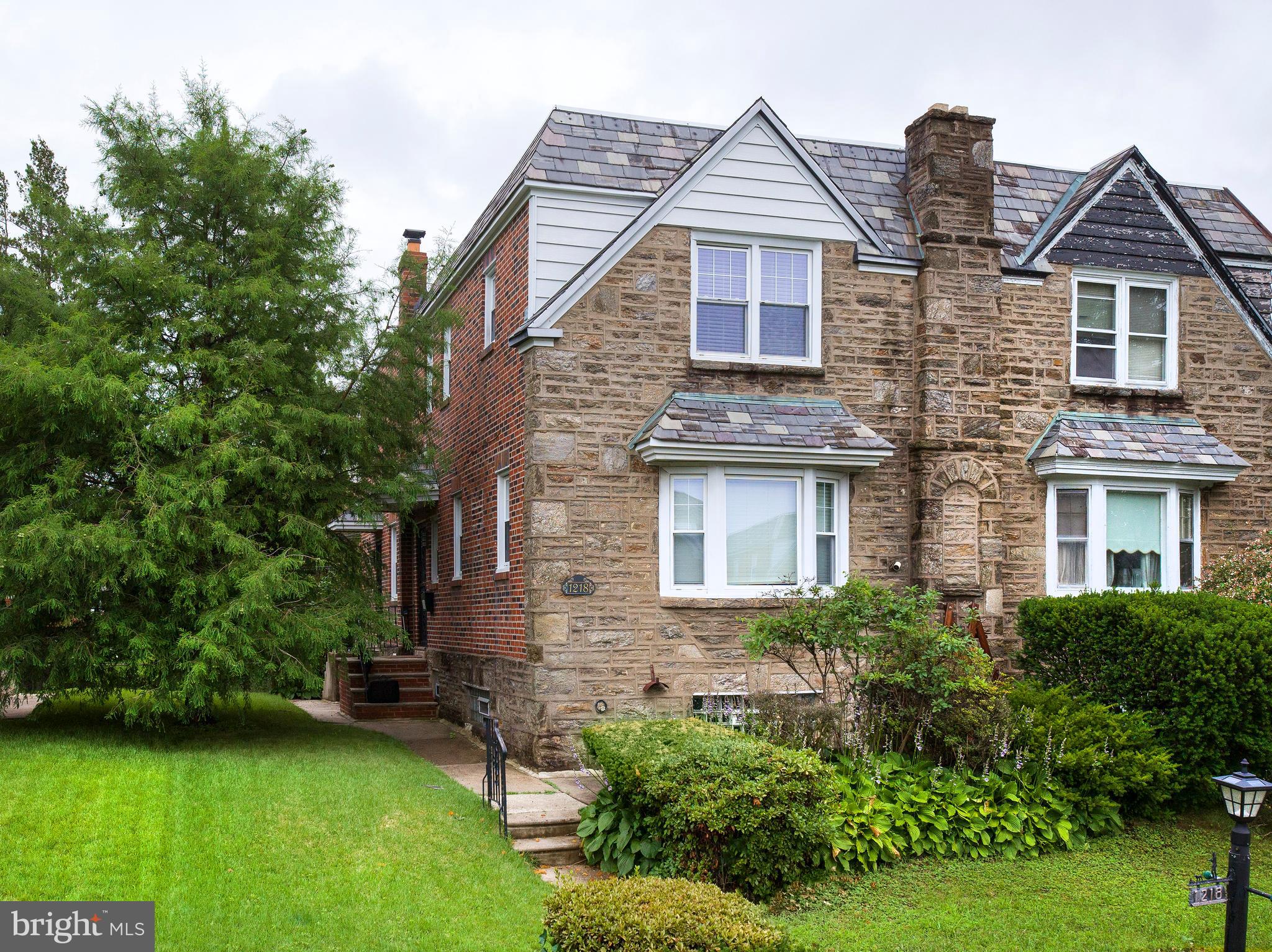 A masterfully renovated gem in the heart of East Mount Airy, 1218 E Cliveden Street blends timeless charm with high-end modern finishes across three beautifully finished levels.
From the moment you arrive, the home’s curb appeal is undeniable—featuring a newly poured front sidewalk, manicured front lawn, and a welcoming patio framed by clean architectural lines. Step inside to discover an open-concept main floor designed for both function and flow, with wide-plank hardwood floors, elegant crown molding, and abundant natural light throughout.
The living room centers around a striking electric fireplace clad in grey and white brick veneer, creating a warm yet sophisticated focal point. At the heart of the home is a chef-worthy kitchen appointed with white soft-close shaker cabinetry, Calacatta Laza quartz countertops with ogee edge detailing, a 7-seat waterfall island, and a full suite of stainless steel Energy Star appliances. French doors open to a 17-foot composite deck, seamlessly extending your living space outdoors.
A stylish powder room and guest coat closet complete the main level. Upstairs, retreat to a spacious primary suite with dual closets and a spa-inspired en-suite bath. Two additional bedrooms offer generous proportions, recessed lighting, ceiling fans, and well-appointed closets—including a walk-in cedar closet. A sleek hall bath and dedicated laundry room with front-loading washer/dryer add everyday luxury and convenience.
The fully finished lower level offers exceptional flexibility, perfect for a media lounge, gym, home office, or guest suite. This level also includes a third full bathroom, two walk-in closets, a finished utility room, and interior access to the one-car garage and driveway. A rear mudroom with exterior access leads to the partially fenced backyard.
Additional upgrades include:
• 95% high-efficiency heating system
• New 50-gallon hot water tank
• New central air conditioning
• Two new exterior entry doors
Located just blocks from Pleasant Playground, Germantown Avenue dining and shopping, and regional rail stations, with easy access to Chestnut Hill and Center City. Schedule your showing today!
Please note- some photos are digitally staged