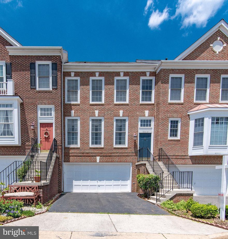 Fabulous 2 car garage brick front townhome in sought after South Riding, A very well kept townhome with gleaming wood floors through out, Oak stairs, Structural extensions on All 3 levels for added space. Double decks with a built in bench, Inviting foyer leads you to main level with bright and open living room and Formal dining room, Huge kitchen with sitting area and sun room.
This gourmet kitchen has sturdy oak cabinets, Granite countertop installed in 2018, Built in microwave.
Grand master suite with cathedral ceiling and sitting room which is perfect for an office space, Master bathroom boasts tile floors, Double vanity, Separate soaking tub and shower. 2 other spacious bedrooms upstairs sharing a hall bath with Double vanity again, with a tub, tile floors. Laundry room is conveniently  located on bedroom level, Both washer and dryer replaced in 2018.
Walk out basement with a bedroom, Sliding glass door leading to lower deck, Cozy gas fire place in rec room with engineered floors. 
HVAC replaced March 2022!
All offers due Monday June 20, 10 AM.