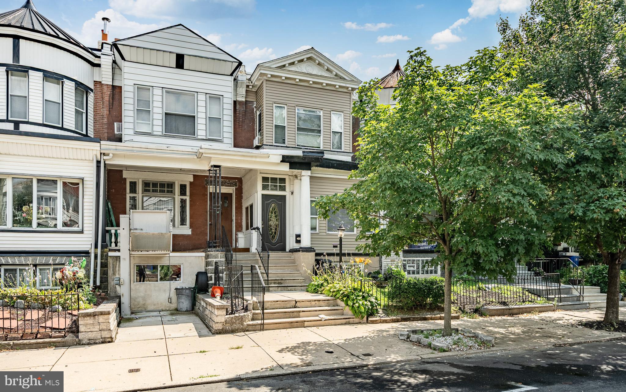 Located in the heart of Cobbs Creek, this large 2-story home has plenty to offer. There are 4 bedrooms with plenty of closet space, 1.5 bathrooms (both of which have been renovated), and a partially finished basement. It has a large and recently renovated kitchen that's perfect for those who like to cook, the kitchen includes updated cabinetry and stainless steel energy efficient appliances. There is a separate dining room area sandwiched between the kitchen and living room. The living room has a fully functional wood burning fireplace which is lovely to commune around during the colder months. The finished basement includes a bar, laundry area, and a renovated half bathroom. On the 2nd floor you'll find 4 bedrooms, each with plenty of closet space. There's also a renovated full bathroom with a skylight and soaking tub. Lastly, you'll find plenty of outdoor space, there is a back yard with a deck, a well-kept garden out front, and an enclosed porch.
Other positives: A new roof was installed in 2024, there is a new water heater and boiler unit, water mitigation equipment was used in the basement prior to it being finished, PVC plumbing lines, and new windows throughout.
This house is a block and a half away from the Cobbs Creek Park which includes a playground, tennis courts, a swimming pool, and more. Accessible by SEPTA (46 & 57 Bus, 34 Trolley).
Basement carpet has been removed so that floors can be finished to buyers liking.