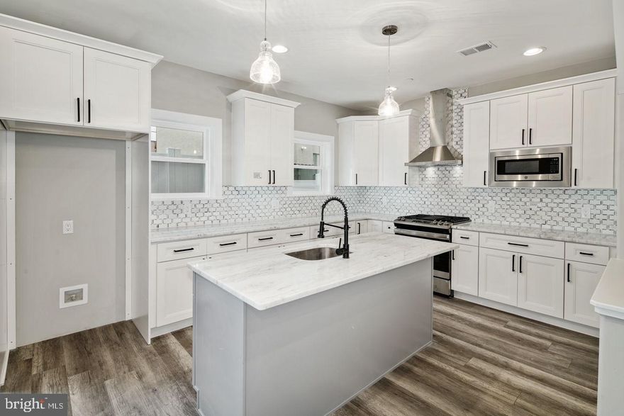 HUGE and 25 ft wide, absolutely STUNNING new construction home with luxury finishes and ENORMOUS rooftop deck! Two master suites - one of each level! Light-filled bedrooms and modern bathrooms. Hardwood floors and tile throughout. Lower level has a huge living area with tons of sunlight. Gorgeous kitchen with slide in range, professional hood above the island, granite countertops, stainless steel appliances, tons of storage including a walk-in pantry and access to a huge private, fenced rear yard! Third floor master suite has a custom tray ceiling with crown molding illuminated with accent lighting, two walk in closets, a private bathroom with double vanity and a large glass enclosed shower. A wet bar in the hallway, next to the master suite, services the master bedroom and the roof deck. Find bonus entertaining space in the finished basement with a full bathroom. The home is equipped with a technology package that includes built in speakers, video doorbell, nest thermostat with two zones for heating and cooling, plus an alarm system. Top quality new construction at a very reasonable price, built by the Philly's 2019 Developer of the Year - V2 Properties! Builder warranty included. Approved 10 year tax abatement. All square footage numbers are approximate and include above and below grade measurements. Square footage and real estate taxes are the responsibility of the buyer to be verified.