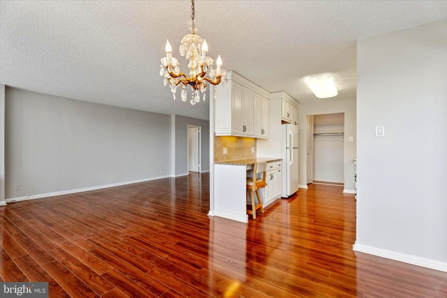 Welcome to the Community of Green Hill, where this tenth floor condo offers spectacular views and abundance of natural light awaits you!  This bright and sunny updated unit offers an open floor plan with two bedrooms, two full baths & laundry facilities. Entry foyer to a spacious living room and dining area with beautiful hardwood floors.  There is a slider to a balcony that is the perfect space for outside entertainment or to relax in privacy with your morning coffee or enjoying a glass of wine as the sun sets.
The modern Galley Kitchen features upgraded appliances with electric cooking, built-in microwave, dishwasher, garbage disposal, great cabinet space and granite counter tops.  The Primary Bedroom is generously sized with two closets and a full bathroom. Additional highlights of this unit include a second bedroom with second bathroom and a walk-in hall closet.  Full size washer and dryer.  There is a storage bin the lower level.   With 1,222 sq. ft. of living space, there is plenty of room to make this your own. This unit has just been freshly professionally painted throughout and new premium carpets installed in both bedrooms.  The electrical service was just updated with a new electric panel.  This unit also has a deeded indoor garage space - #51.   Enjoy the peace of mind provided by the 24-hour Gated Community with staffed security at the entry to the property and a friendly 24-hour Doorman at the building.  The Green Hill offers a multitude of amenities for its residents such as a Library, Meeting Rooms, Elevators, Courtesy Bus, tennis courts, modern playground, health club(fee), seasonal outdoor pool (fee), indoor heated pool and gym (fee) and is in the award-winning Lower Merion School District.  There is courtesy shuttle bus service goes to area shops, train stations, Lankenau Hospital, etc.  The monthly HOA fee includes all utilities including water, electric, heat & air conditioning and the owner pays for cable/internet/phone.  Enjoy easy access to Center City by car or train and the convenience of all things on the Main Line such as Whole Foods, Trader Joe’s, Giant and the award-winning restaurants of the Main Line and the City Avenue corridor.  This may be the best value on the Main Line and the one you have been waiting for!