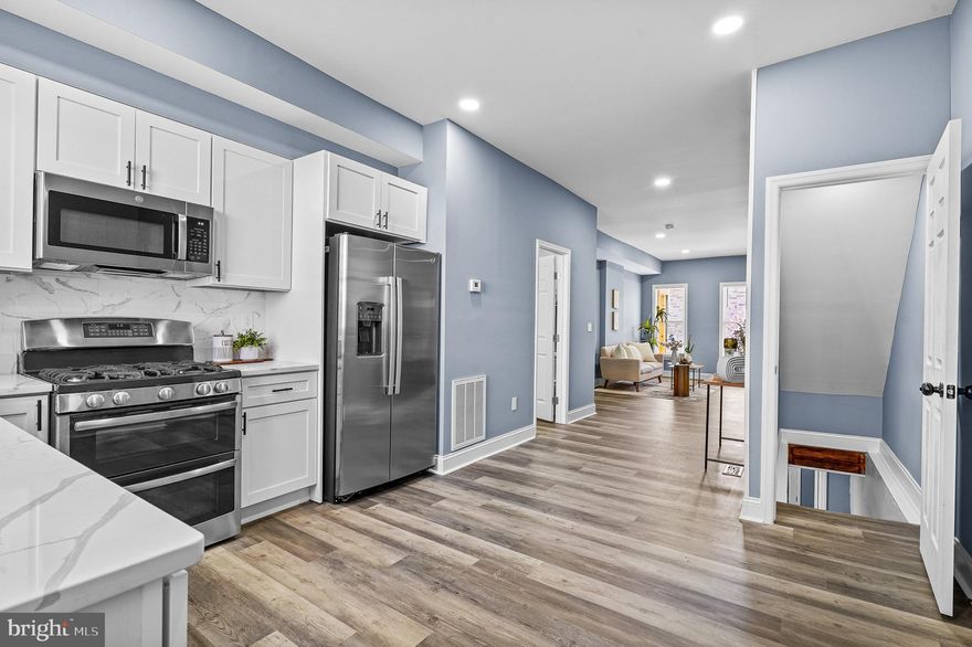 Stunning Renovated, located in the Irvington area of Baltimore City. 4-Bedroom Townhouse with 3 Finished Levels!
Step into this beautifully renovated townhouse, offering three finished levels of modern design. With 4 bedrooms and 2.5 bathrooms, this home perfectly blends contemporary luxury with practical comfort. The bright, open-concept main level features meticulous updates and stylish finishes. Perfect for entertaining, the formal dining area flows seamlessly into the gourmet kitchen, complete with stainless steel appliances and sleek quartz countertops.

On the second floor, you'll find three spacious bedrooms and a well-appointed hallway bathroom.

The fully finished basement adds even more living space, featuring a bedroom and a full bathroom, plus a walkout exit to the backyard. This home offers the ideal combination of style, space, and functionality for comfortable living. Don’t miss your chance to see it—schedule your private showing today!