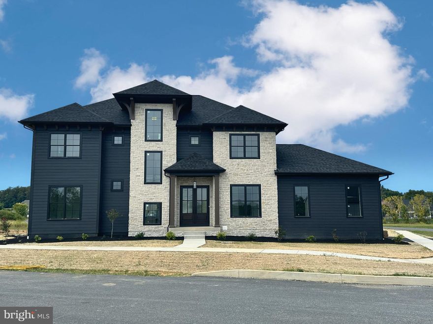 Enjoy the perfect blend of luxury, comfort, and functionality in this newly completed Costello home. Located in Brooklawn, this custom-built beauty showcases meticulous attention to detail with a light-filled, open floor plan, soaring 10-foot ceilings, and exquisite architectural trim work throughout. The gorgeous kitchen is a chef’s dream, featuring custom cabinetry, quartz counters, commercial-grade appliances, a spacious walk-in pantry, and an oversized island, making it perfect for entertaining. The luxurious primary suite is a true retreat, boasting a spa-inspired bath with exquisite tile work, a deluxe walk-in shower, and a generously sized closet. Enjoy additional living space with a finished lower level, complete with a full bath and ample storage. A first-floor study provides the perfect workspace, while the three-car garage offers plenty of room for vehicles and organization.  A large mudroom offers custom cubbies for all the day's accessories. Step outside to a covered porch with an outdoor kitchen overlooking a well-sized corner lot. The home is nestled in a lovely community with convenient access to Landis Woods walking trail, offering the perfect spot for a relaxing stroll or some exercise. Ideally located just minutes from top-rated schools, shopping, parks, dining, and major travel routes, this home is an exceptional opportunity in one of the area’s most premiere locations.