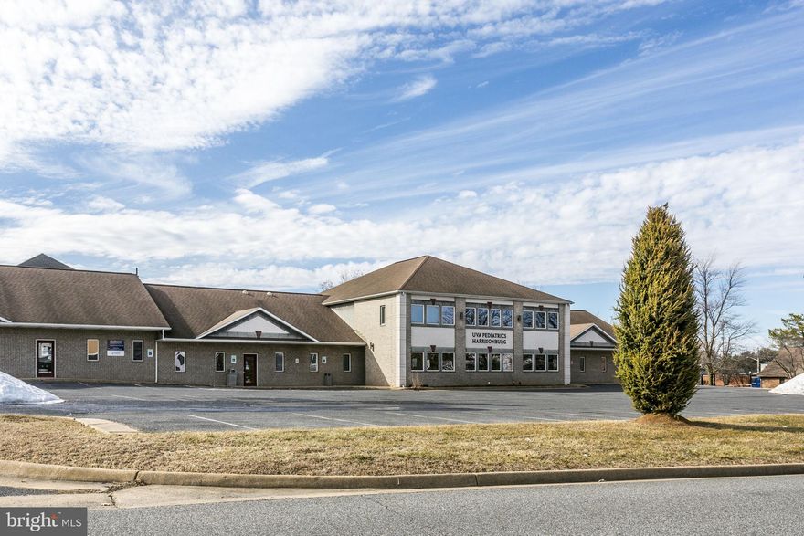 Well-maintained 10,950 SF two-story brick medical office condominium currently leased to UVA Pediatrics, which has operated at this location for 10 years. The lease expires August 31, 2026, after which it converts to month-to-month until the tenant relocates. Under the NN lease, the tenant pays property taxes, insurance, and all repairs and maintenance except the roof. Constructed in 1998, this attractive property offers a highly functional layout featuring 20 exam rooms, 18offices, a conference room, 9 restrooms, multiple storage rooms, a kitchen/meeting room, 3 separate entrances, ample parking on a 1.02-acre site. The property is ideally located in a strong medical and retail corridor, surrounded by numerous national retailers and professional offices. It is situated just 0.5 miles from James Madison University and less than 2 miles from Sentara RMH Medical Center, making it a strategic location for continued medical or professional office use. Excellent opportunity for investors or future owner-users.