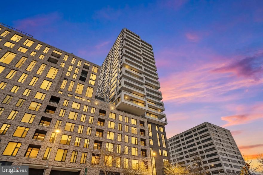 Welcome to elevated living at The Verse at The Boro, one of Tysons’ most sought-after luxury residences. Perfectly positioned in the heart of the vibrant Boro District, this stunning 2-bedroom, 2-bath + den condo combines sophisticated design, breathtaking views, and unmatched convenience.

From the moment you enter, you’ll notice the 9.5-foot ceilings and dramatic floor-to-ceiling windows that flood the home with natural light and frame sweeping skyline and mountain views. The open-concept layout flows seamlessly into a chef-inspired kitchen designed by Cecconi Simone, featuring sleek Italian cabinetry, concealed appliances, quartz countertops, and a striking waterfall island—perfect for entertaining or enjoying everyday luxury.

Step outside onto the expansive 32-foot west-facing balcony and take in unforgettable sunsets and unobstructed mountain views—an exceptional feature unique to this section of the building.

The primary suite is a private retreat, complete with two walk-in closets and a spa-inspired bathroom with marble finishes and a luxurious walk-in shower. A spacious second bedroom and large bath provide comfort for guests, while the versatile den offers the perfect work-from-home office or guest space with its own beautiful views. Additional highlights include designer blackout electric Roman shades, custom closet systems, reserved garage parking space.

Residents of The Verse enjoy exceptional resort-style amenities including 24-hour concierge service, a state-of-the-art fitness center and yoga studio, a stunning Sky Park with pool, lounge areas and grills, an elegant resident lounge, private outdoor patio, pet spa, guest suite, and automated package retrieval with Amazon Hub lockers.

Step outside your door to experience the best of Tysons living with Whole Foods Market, North Italia, Flower Child, Bluestone Lane, CIRCA at The Boro, and LOOK Dine-In Cinemas just steps away. Shopping at Tysons Corner Center and Tysons Galleria is minutes away, while the nearby Greensboro Station on the Washington Metro Silver Line provides easy access to Washington, DC and Washington Dulles International Airport.

This is luxury, lifestyle, and location—perfectly combined. Schedule your private showing today and experience why The Verse is one of Tysons’ premier addresses.