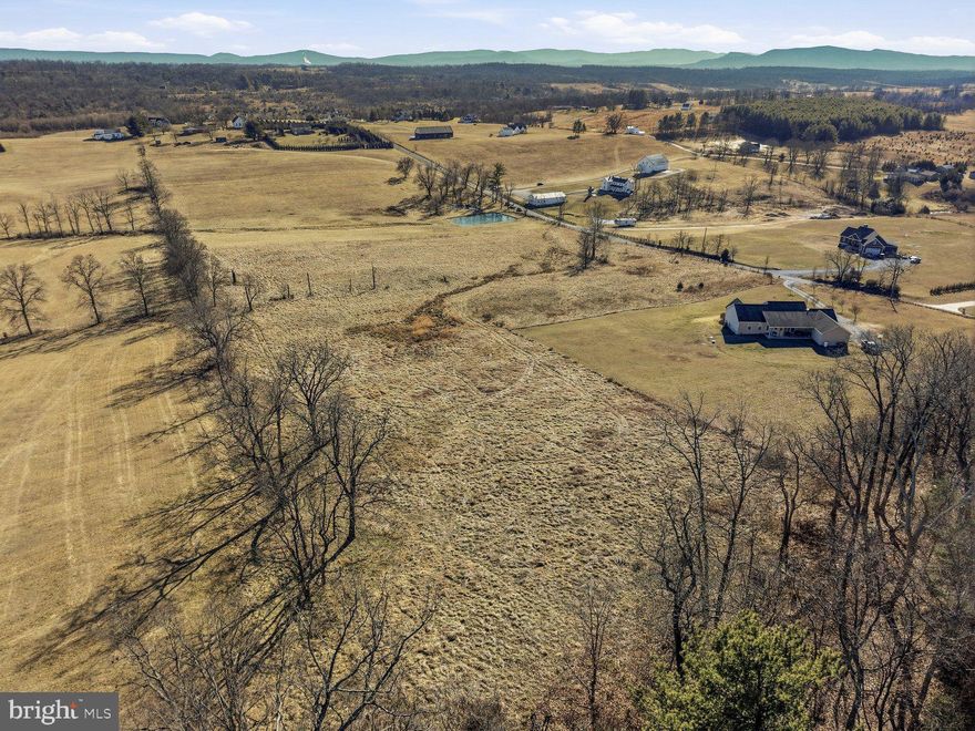 Premium lot, ready to build on! This  8 acre parcel offers a rare combination of views, usable acreage, and convenience. Set approximately 800 feet off Cedar Creek Grade with frontage on Gough Road, the elevated homesite captures exceptional, wide-open mountain views and a peaceful, bucolic setting. Surrounded by farmland and in an area with attractive and newer, custom homes, this property feels tucked away while remaining just 7 miles from town. A 4 bedroom perc is already in place, making it easy to move forward with your plans. Whether you are dreaming of a private estate, a small farmette, or a quiet retreat, this beautiful piece of land offers the space, scenery, and setting to bring that vision to life.