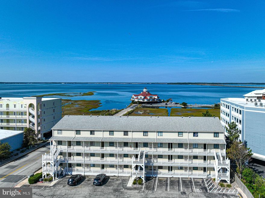 Spectacular bay views and convenient midtown location, Jamaica IV #202 is the perfect beach home getaway.  Enjoy unobstructed sunsets from the private, covered balcony.  Great space and flow from the living room to the kitchen with countertop seating for four.  Spacious bedroom with plenty of room for king sized bed.  Easy access from Rt. 90 and just a few blocks from the beach.  Take advantage of the proximity to some of OC’s best restaurants and entertainment.  Condo upgrades since 2013 include roof replacement, window and sliding glass door, new stairwells, and balcony railings.  Great investment opportunity or make the beach your home!