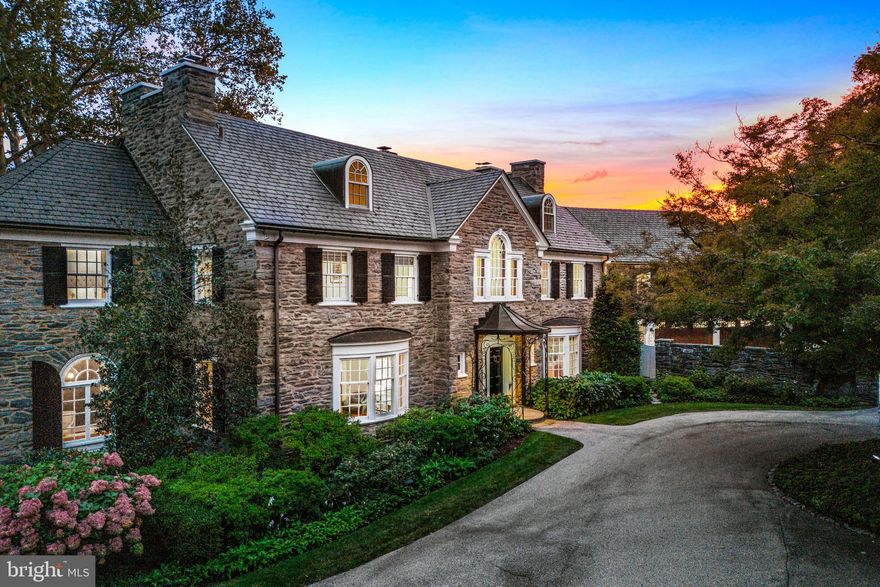 Completely renovated with sophisticated designs and high end systems throughout. Welcome to Stony Lawn, an incredible, all stone, sun-filled residence designed by Durham and Irvine in the 1920s. It remains one of the Main Line’s landmark estate properties. It was seamlessly expanded and improved by E.B. Mahoney builders in 2010 and impeccably renovated with sophisticated, modern designs and systems in 2017 by the current owners working with Peter Zimmerman Architects and Cullen Construction. Beautifully set on a breathtaking 2.84-acre lot in the coveted North-side Villanova estate neighborhood, it is enhanced with centennial trees, stunning pool, paddle ball court with a warming hut, four garage bays, glorious gardens and sweeping private views. Interior features include a bright, open floor plan, gracious room sizes with high ceilings, fresh fixtures and decor, original, restored architectural moldings, millwork, and stunning hardwood floors throughout the entire residence. A dramatic two-story foyer and majestic elliptical staircase greets you with open sightlines to the extraordinary grounds The library features full paneling, carefully crafted built-ins, a hideaway bar, and a fireplace. Living and dining rooms with fireplaces are large and inviting, and a private office has stunning views of the grounds. A fabulous gourmet kitchen with Sub-Zero and Wolf appliances opens to a bright breakfast room, fireplace, and family room with gorgeous views and easy access to the generous mudroom, stone terraces, pool, paddle ball court, and grounds. The completely  reconfigured second floor includes the bright, luxurious primary suite featuring his and hers marble baths, walk-in dressing rooms and a fireplace. Four ample bedrooms include two ensuite baths and one jack-and-jill off the second staircase that could easily be used as an in-law or au pair suite. An open staircase leads to the third floor, offering an expansive bonus room, built-in for additional storage, and a powder room. The dry lower level boasts new systems and generous storage space. Look no further and enjoy this rare find with complete privacy and unmatched convenience to renowned public and private schools and universities, easy access to trains and all forms of transportation, world-renowned clubs and golf courses, equestrian centers, restaurants, and recreational facilities. A premium property in a highly coveted Main Line location.
