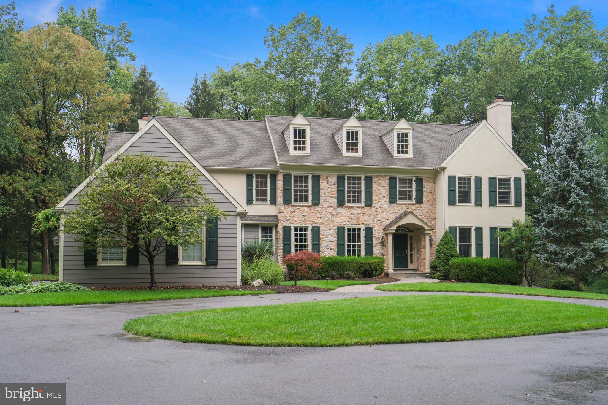 Welcome to this exquisite Haller built custom home nestled on a picturesque lot within the Briarwood community located in bucolic Charlestown Township. Enter this beautifully appointed home from the circular driveway into the grand view-through reception hall flanked by the gracious formal dining room and fire-side formal living room. Through french doors, step into the spacious study with cherry built-ins and view of the private rear yard. Entertaining is a pleasure in the timeless gourmet kitchen boasting white custom cabinetry with crown molding, commercial grade appliances, oversized granite island with utility sink, plus a scotsman built-in ice machine. A well appointed butler’s pantry with sink and second dishwasher connect the dining room and kitchen. Enjoy the light and bright morning room with tray ceiling and outside exit to rear deck. Adjacent to the kitchen is the sun-filled cozy family room with gas fireplace, semi-vaulted ceiling and wall of windows. The stylish mud-room offers access to the rear staircase, 3 car garage and side yard entrance. Both formal and informal half baths complete this level. Ascend the gracious turned formal staircase to find the well appointed primary bedroom suite with beautiful coffered ceiling, gas fireplace, customized walk-in closet and luxurious spa-like primary bath with porcelain tiled floor, double vanities, soaking tub and over-sized walk-in shower. Down the hallway are four additional nice sized bedrooms connected with ‘jack and jill’ bathrooms. In addition, there is a convenient second floor laundry room. The finished daylight walk-out lower level offers a full bathroom, media room, game room, and exercise room, plus a large unfinished area great for storage! Enjoy entertaining on the custom rear deck with hot-tub overlooking the secluded backyard. Truly turn-key, this fabulous home boasts site-finished hardwood floors, magnificent millwork, neutral decor, surround sound, three fireplaces and so much more for the discerning buyer. Location, location, location offers easy access to all Great Valley schools, a myriad of shopping and dining (small businesses/boutiques & malls), corporate centers, hospitals, trains, major commuting routes and the ever popular Valley Forge National Park.