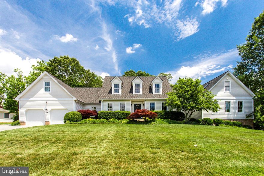 BIG SPRAWLING CAPE COD   will delight your senses as you enjoy the ample natural lighting that is throughout this comfortably upgraded home. Attention to detail at every turn makes this home both beautiful yet, comfortable with well thought out workspaces! There are three quarter inch Canadian Maple natural wood floors throughout the main level. The kitchen comes with elegant yet practical workstations with loads of storage in the classic shaker style cabinets and plenty of counter space on the quartz countertops. There is a large island with built-in microwave oven and plenty of drawers for storage.  The kitchen also has stainless steel appliances. The breakfast nook and family room are right off of the kitchen, so this floorplan flows nicely when you are entertaining. And why not extend your kitchen into the outdoor area? There is a wonderful brick terrace with a built in (48 inch inside diameter) brick firepit and a built in Lynx Grille/Rotisserie as well as a custom-built brick wood-fired pizza oven imported from Italy!  You will also find a convenient 2 burner gas cooktop for preparing those side dishes. There is plenty of space for your guests to spread out and enjoy all that this outdoor oasis has to offer   even built in outdoor hardwired speakers! A screened porch completes this outdoor space. This elegant home features both a formal living room and a formal dining room with crown moldings. At the end of the wide hallway, you will find the luxurious master suite. There are dual dressing room vanities and a huge walk in closet with organizers on the walls   plenty of room for everything! The master bath features a deep and wide jetted soaking tub as well as a large walk-in shower with 14 different sprayers and steam, and a large vanity. There is a separate master lavatory room with another sink vanity and commode, as well. On the top level, over the master suite, you will find a huge office, with its own entrance door from the outside! The office is L shaped with lots of natural light and high-tech wiring   as well as plenty of electrical outlets. There are stairs that lead from the Upper Level office to the basement level where you will find a large finished room   perfect for a media room, gym or toy room. It too, has direct access from the outside.  Also, on the upper level of the main house, you will find 3 bedrooms and a bathroom.  One of the bedrooms has a sitting room in the back of it as well. This home is wired for hi-tech with CAT 6A wiring. The master suite/office addition is all 2x6 construction, there is all LED lighting, and there are 8 ductless mini splits interior and 2 exterior units. These are very energy efficient and there are heat pumps as well as gas back up heat available and there is a hydronic furnace, too! The home also features smart wiring with Verizon Fios. There are 2 tankless hot water heaters   one at each end of the house.  The 14x36 foot shed has exensive shelving and electric (240 volt panel) and 120V outlets for air compressors or welders. The house has 350 amp service. There is also a French drain system that directs water into dry wells. You will also find a 2nd shed that is set up with doorways to be used as an insulated  kennel if desired   there is also a fenced area around it for pets. The entire rear yard is fenced in with 6  board on board privacy fencing. It is an easy commute to Washington DC, National Harbor, Pax River NAS, Joint Base Andrews and point South. Come take a look - This home will not disappoint!