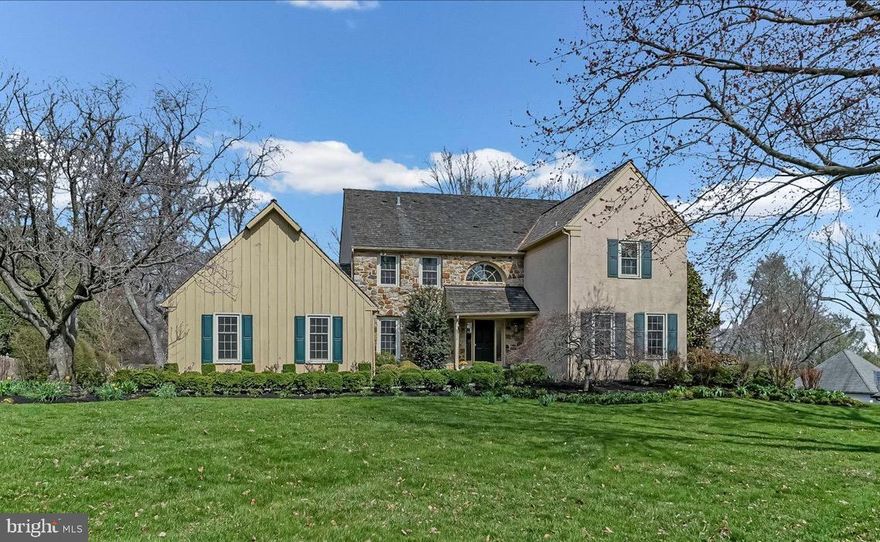 Step into timeless elegance with this stately French Colonial, cherished by one family since its inception. Nestled at the end of a private, no-through cul-de-sac in the highly sought-after North Side of Bryn Mawr, Lower Merion Township, this 4–5 bedroom, 3.5 bath residence boasts over 4,000 +/- square feet of sun-drenched living space. The home sits on a meticulously landscaped  .63-acre lot, complete with specimen plantings, a fenced yard, and serene privacy. From the moment you arrive, the curb appeal enchants. A Belgium block-lined walkway leads to the grand two-story entrance with a turned staircase, setting the tone for this remarkable home. Designed for both grand entertaining and intimate family living, the circular layout ensures seamless flow, with no wasted space. The first floor offers expansive and versatile living areas. A private home office and refined formal powder room provide convenience, while the step-down living room boasts soaring ceilings and a marble gas fireplace. The elegant dining room, with custom Marvin doors, opens to a sprawling deck overlooking the lush, tranquil backyard. At the heart of the home is the spacious chef’s kitchen, featuring abundant wood cabinetry, tiled countertops, a large center island, and a breakfast room with a wall of windows framing the gorgeous gardens. The kitchen flows effortlessly into the stunning step-down family room with vaulted ceilings, a floor-to-ceiling stone fireplace, and direct access to the deck—perfect for al fresco dining, family gatherings, or summer BBQs. Completing this level is a mud/laundry room with access to the oversized two-car garage. Upstairs, the primary suite is a true retreat, privately situated behind double doors. It features a marble fireplace, his-and-hers walk-in closets, and a sumptuous marble bathroom with vaulted ceilings, a skylight, a jetted soaking tub, a stall shower, and a double vanity. Three additional generously sized bedrooms, all with large closets and double windows, share an updated hall bath with designer subway tile, mosaic accents, a soaking tub, and a frameless glass shower. The walk-out lower level expands the living space further, with a game/media room, home gym, guest room or office, full bath, and ample storage. Located just moments from Rosemont, Bryn Mawr, and Center City Philadelphia, this home is also part of the award-winning Lower Merion School District. Whether you’re ready to move right in or bring your personal touches to make it your own, this exceptional property offers unparalleled lifestyle and opportunity. Don’t miss your chance to call this special home your own!