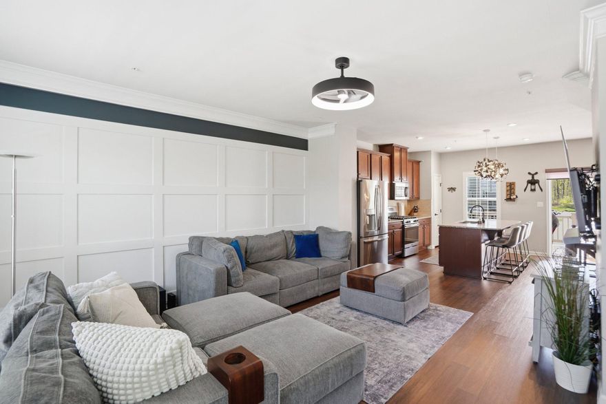 Welcome to this beautifully upgraded newer townhouse that perfectly blends modern style, flexible living space, and everyday convenience. From the moment you enter, you’re welcomed by a versatile lower level designed to fit today’s lifestyle, featuring a den, rec room, and dedicated workout space. This level also includes a powder room, utility closet, and convenient access to the one-car garage. The main living level is bright, open, and ideal for both daily living and entertaining. The spacious kitchen is the heart of the home, offering abundant cabinetry, granite countertops, tile backsplash, stainless steel appliances, and plenty of prep space. Enjoy casual meals at the oversized island, gather in the eat-in dining area, or create the perfect coffee bar with extra storage to keep everything organized. Just off the kitchen, the living room features an eye-catching accent wall, crown molding, and engineered hardwood flooring, creating a warm and inviting space to relax or host guests. Upstairs, retreat to the luxurious primary suite complete with a tray ceiling, accent wall, and durable LVP flooring. The ensuite bath offers dual vanities and a sleek walk-in glass shower. Two additional bedrooms and a full bath with a tub/shower combo provide comfortable accommodations for family, guests, or office space, while the convenient upper-level laundry makes everyday living even easier. Step outside to the composite deck off the kitchen, perfect for entertaining, grilling, or enjoying your morning coffee. Parking is effortless with a one-car garage and two-car driveway. Residents also enjoy fantastic community amenities including a pool, clubhouse, playground, and open green space. Ideally located near White Marsh Blvd, White Marsh Mall, I-95, I-695, Route 40, and countless shops and restaurants, this home offers the perfect combination of style, space, and location.