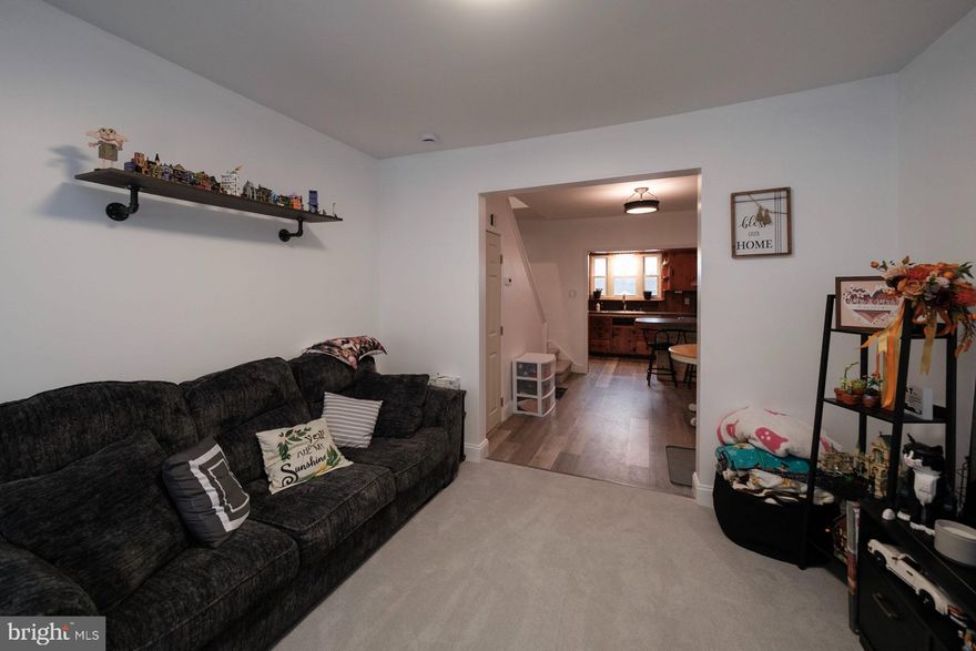 The sellers have pured a lot of love into this cozy home. The electrical system in the house has been redone. There is fresh flooring throughout. The kitchen countertops have been replaced. The lighting is modern. Walking onto the porch and through the front door leads into the living room. Through the living room you enter the dining room which opens into the kitchen. Though small, the kitchen is well packaged with lots of cabinets and storage. 

The second floor has been configured as a bedroom suite, opening up the second bedroom to flow into the main front room and the bathroom behind it. There is a walkup attic which provides a storage area.

Don't be fooled by the unusual property boundaries. Walking out of the basement into the backyard, you'll find a pathway that leads behind the neighbor's garage to the several garages and sheds belonging to the listed property. The first building is a large red shed. The second is a 2 car garage. The Third is a smaller shed for lawn equipment. The property stretches out to the alley and down to the mature trees bordering the park. Please see survey in pictures for more details.