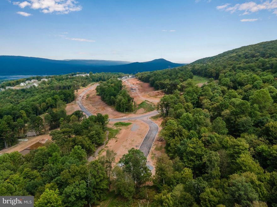 Ready to claim your own slice of paradise? This 11+ acre wooded wonderland in Rockville Estates isn’t just land—it’s your future backdrop. Imagine building your dream home with Yingst Homes Inc. where modern design meets nature’s best gallery. Enjoy endless trees and panoramic views that are practically begging to be your next Instagram story. This lot is the canvas for your next big adventure. Trust us—Mother Nature approves, and your future self will thank you for the escape. Let’s build something epic!