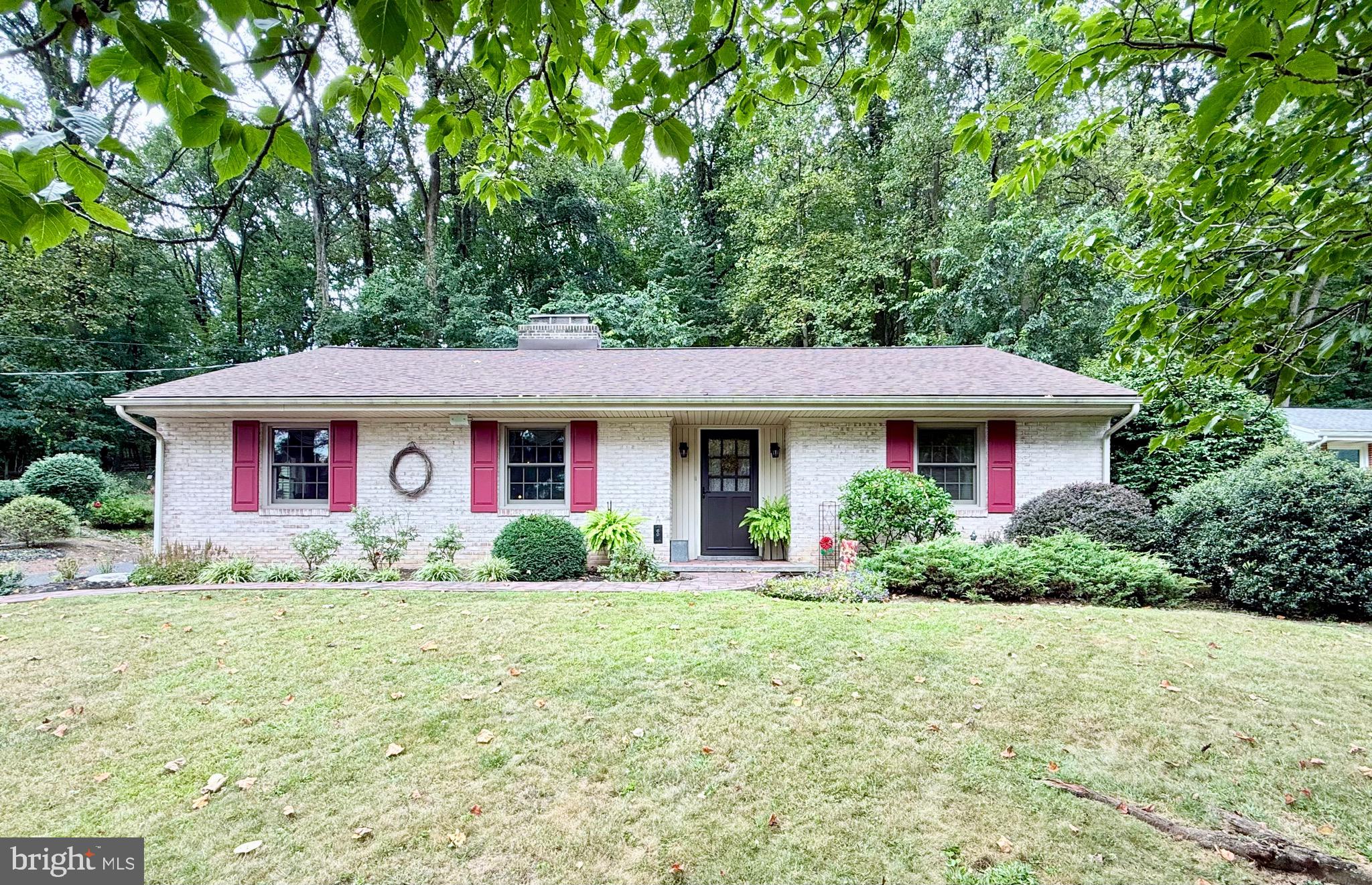 Super charming ranch home in Hershey, the sweetest place to live! This cozy yet roomy home has woodwork throughout with two working wood fireplaces and a wood burning stove make this home extra warm and cozy in the upcoming cooler months. Home features three bedrooms on the main level and one full bath, beautiful original hardwood floors refinished to a golden luster. Wood beams and wood ceilings compliment the charm of this beautifully crafted home which adds warmth to the living room space. Large very functional kitchen with built in cabinets and large pantry and natural stone counters make for an amazing cooking/dining experience. Moving through the kitchen enter into a large living area great for entertaining friends and family with views of the wonderful wooded area in the back yard. 600 Sq Ft of heated and air conditioned living space, featuring a wood burning stove to warm the room for the holidays. Plenty of natural light form the skylights, windows and doors that give way to the thoughtfully designed hardscaped patio for enjoying the natural scenery and wildlife right in your backyard. Great for relaxing with a glass of wine and a book or open the doors up for more guests if you like to host parties, there is something for every discerning taste in this wonderful home. This home has so much to offer including a partially (mostly) finished basement with a private fireplace and living space that could be used as a fourth bedroom or guest room that has it's own full bathroom, it's like a mini AirBB retreat! Large two car garage for all your car and storage needs. Many recent upgrades like all new Anderson top rated replacement windows and more, ask your agent to see documents for a list of recent updates. Also see documents for list of items for sale, prices negotiable on items for sale. Amazing home with too many features to mention, come and see it for yourself today. Don't wait too long this one won't last.