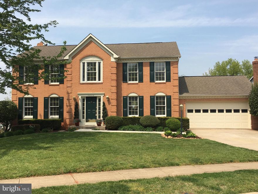 REDUCED $20,000-SELLER NEEDS TO SELL. Beautiful new hardwood floor on main level & new carpet on upper and lower floors. Brand new s/s appliances, freshly stained deck. 5 bedrooms upstairs and bonus room in basement that's perfect for au-pair or in-laws. Walk out basement to  patio. Home in excellent condition but being sold as-is. 28/7/tollway, Dulles,new metro.