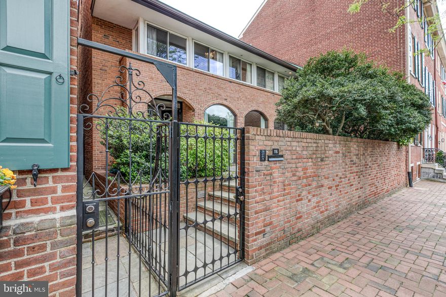 The tranquility of this bright 1965 mid-century modern home must be experienced for its quality and authenticity. Graciously proportioned, the home is 34'  wide and has a lot depth of 80'. The home is situated on one of Philadelphia's charming, cobblestoned, tree-lined blocks of famed Delancey Street. Gated, and with a large front flagstone terrace, the home is uniquely buffered from pedestrian and street traffic. The mature plantings provide a Zen-like view from the large living room windows. The width of the residence begins to define its livability; at 3,000 sq. ft. the home has 4 bedrooms, 3 full bathrooms, a first-floor powder room, period wooden built-ins, amazing storage and a large 2nd floor balcony stretching the width of the property. Custom details include large living and dining rooms, dual-facing fireplace, spacious eat-in kitchen, an enclosed European style lap pool followed by a uniquely landscaped rear flagstone patio and garden. Centrally located, you'll find yourself just steps away from Philadelphia's most historic sites, the Ritz theaters, a broad range of restaurants & commerce, Philadelphia's business district, the arts, mass transportation options and access to the city's main highway systems. Lastly, you're within walking distance to the areas' best public and private schools. Includes 1 year prepaid parking.