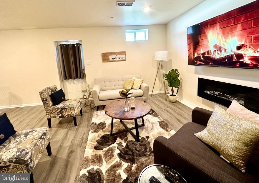 Elegant & Open Space STUDIO BASEMENT RENTAL UTILITIES INCLUDED- A lavishly FURNISHED designed studio awaits, featuring  a full bath with a Luxurious freestanding bathtub, a refined living room area, and kitchenette with opulent granite countertops,  sink, and even a wine refrigerator.   Shared laundry facilities on the main floor.  Studio has its own Entertainment Room with Wide Screen TV, reclining Chairs.  You'll have your own private entrance discreetly nestled at the rear of the property. Fenced property, gate to the back entrance is on the right side of the property. Shower is being installed.  Ref, microwave and hotplate will be added.   Immerse yourself in a prime location, surrounded by premier shopping centers. This basement guarantees complete seclusion,  and all utilities are  included. Pets and smoking are not permitted. To qualify, credit score of 640+ is required by the  landlord. Lease term of one year, renewable.
Landlord may take a few items/furniture but tenant may use most of the furniture.  Tenant to bring own bed and dresser. Refrigerator, standalone microwave, separate electric hot plate will be provided.   Major furniture like couch, TV,  dining table, Entertainment center furniture, Side tables, etc are all provided.