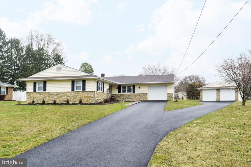 Enjoy the convenience of one-level living. This meticulously maintained home offers many recent updates, including an updated kitchen with 42" cabinets and stainless appliances, new carpet (hardwood flooring under carpet in most rooms) and fresh paint throughout. The mudroom off of the kitchen with laundry area, additional cabinets for storage and direct access to new rear concrete patio. Three spacious bedrooms, including the owner's suite with two closets and a private bath and new light/fan fixtures in all bedrooms. A large family room offers a glass sliding door and lots of natural sunlight plus a cozy pellet stove (2 years old).  An additional living room/bonus room offers flexibility for various uses and could make a great home office, playroom, or entertainment space. One-car attached garage ensures ease and accessibility, plus two-car detached garage that provides ample space for your vehicles or even a workshop. Pride of ownership shows from the moment you arrive, schedule your showing today!