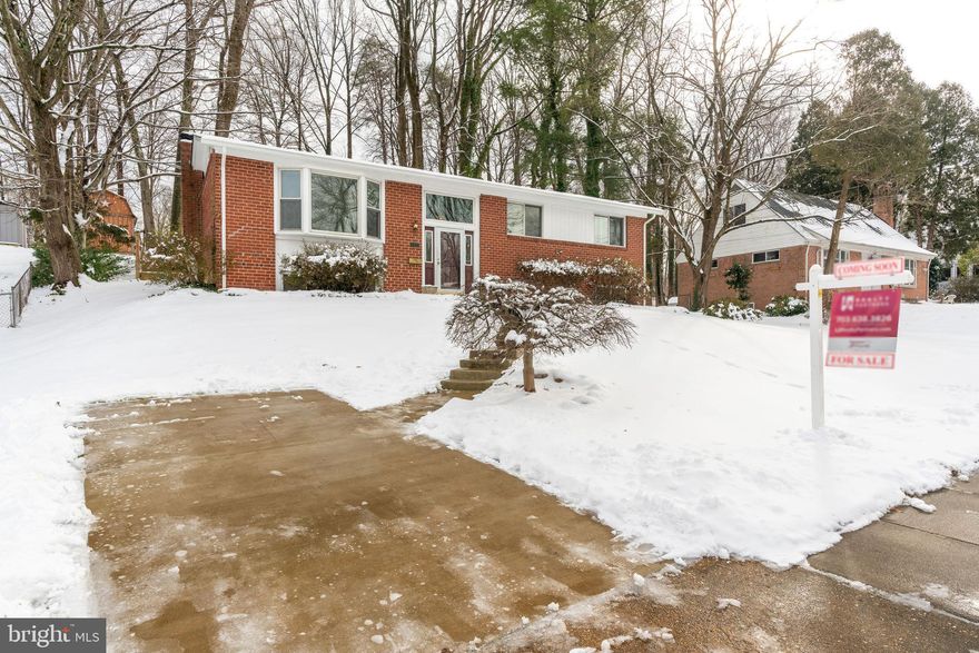 You will not want to miss this amazing opportunity to own this Duke model in Kings Park. 4 Bedrooms and 2 and half baths. Both full baths are beautifully updated. Primary bedroom features cedar closet. Main level features vaulted ceilings and hardwood floors. Kitchen opened up and updated to make this an amazing open concept. Many windows with custom blinds. Walk out from main level to an amazing patio and private extra large yard that backs to woods and Lake Accotink Trail. Lower level features family room with wood burning fireplace, additional bedroom, half bath, plenty of storage and walk up. Newer windows, concrete driveway and HVAC. Roof 1 year old. Lake Braddock pyramid.  Kings Park is a commuter dream location, on bus lines, minutes to VRE, Springfield Metro, Fairfax County Parkway, Ft Belvoir, and I495/95/66. MINUTES to George Mason University. Minutes to Kings Park Shopping Center! NO HOA. Sold AS IS. Come fall in love and make the needed updates and make this your dream home.