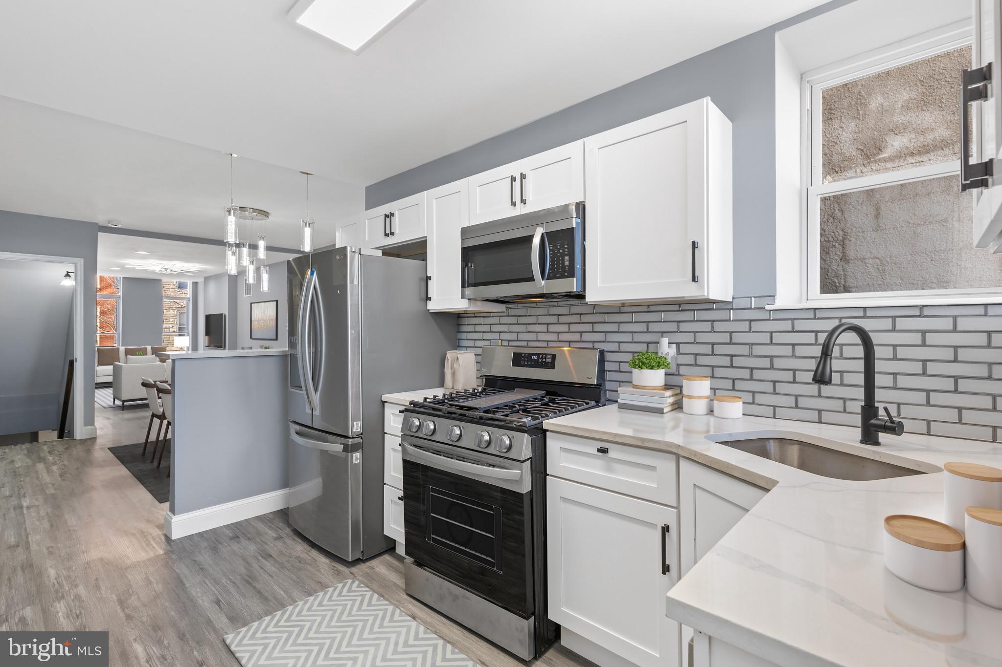 Discover your dream home in the heart of Baltimore City! Conveniently located just 5 minutes from Johns Hopkins, 11 minutes from the Inner Harbor, and 14 minutes from the University of Maryland Medical Center. Perfect for grant buyers, this home is fully permitted and ready for its new owner—just ask for details! This meticulously renovated property offers the ultimate in luxury and modern living. The stunning kitchen features a top-tier appliance package, including a stove with a built-in air fryer, a refrigerator with an LED display and ice/water dispenser, and a cutting-edge washer and dryer set. The upper-level bathroom is a spa-like retreat with a jacuzzi jetted tub, a Bluetooth-enabled speaker system, and a sleek LED mirror. The finished basement offers versatile living space, ideal for entertaining, hosting guests, or creating a home office. The full basement bathroom is equally impressive, showcasing a semi-frameless shower, modern LED mirror, spacious vanity, and a linen closet for added convenience. Step outside to your private backyard oasis, complete with a 6-foot privacy fence—perfect for relaxing or entertaining in style. This home blends comfort, convenience, and sophistication. Don't miss the chance to experience the best of city living! 
Schedule your private showing today and make this incredible property yours.