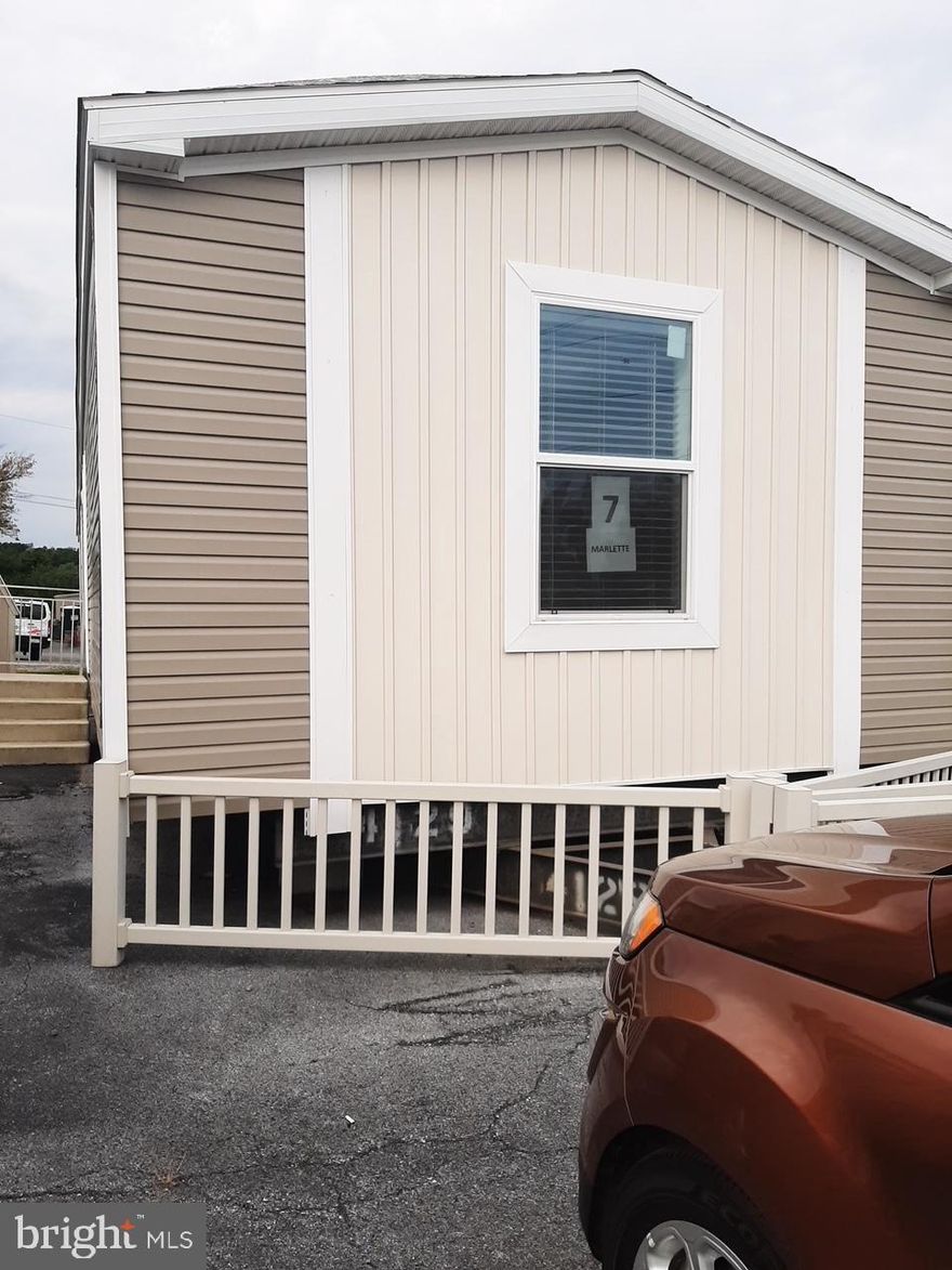 Come see this  three bedroom ,two full bath.  Kitchen has island, deep farmer's sink with pot faucet. Tall deep cabinets & upgraded counters. Living Room is an open floor plan. Master bedroom has a suite with standup large shower and soaking tub. Laundry room is separate  and has a closet for laundry items. This home was built in 2018 and the owners bought it off the showroom lot.   A MUST SEE for the extras. Private two-car driveway.  Spacious yard.  Buyers must be approved by park. Rent is $745. Call for more details.     Listing agent related to sellers  P ROPERTY REDUCED SELLER HAS FOUND HOME OF CHOICE COME SEE YOUR DREAM HOME !!!!!!!!!!!!