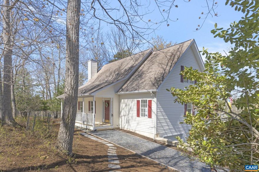 Calling all nature lovers- Tucked away at the end of a quiet cul-de-sac, this rare 1.8-acre property offers unmatched wooded privacy and over 550 feet of pristine waterfront on Lake Monticello, affording the opportunity to enjoy some of the most sweeping views of the lake. Surrounded by mature trees, the setting is peaceful and secluded, ideal for nature lovers seeking a private retreat. As you enter the home through the vaulted entryway, you?re welcomed by an open, airy layout that blends beautifully with the natural surroundings. The spacious kitchen is perfect for entertaining, and the first-floor primary suite provides lake views and direct access to the outdoors. Upstairs, two generous bedrooms with walk-in closets and panoramic lake views perfect for family or guests. The finished terrace level includes a cozy living area, an office, and another bath?perfect for guests or quiet evenings. Whether you enjoy kayaking from your private dock, relaxing on the deck, or taking in the beauty of the wooded landscape, this property offers privacy rarely found on the lake. Located in a sought-after golf course community with resort-style amenities, including a pub with live music, community pool, beaches, tennis courts and more.,Formica Counter,Oak Cabinets,Fireplace in Living Room