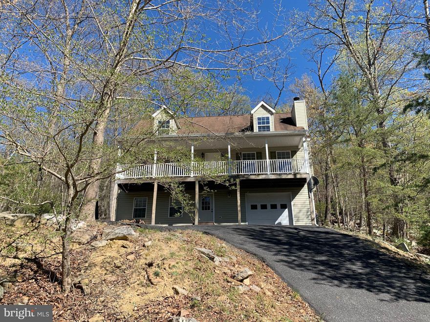 Imagine a lifestyle where you're surrounded by mountains, and endless trees, and have an easy commute. This is Massanutten. Built-in2004, this single-family home offers mountain views from the covered porch and overlooks the George Washington and Jefferson National Forest from therear deck, providing a natural buffer from nearby development. The turnkey home features 1,792sf of finished living area, with an additional 400-900sf lower-level space that can be finished as a rec room or additional bed and bathroom. This home boasts a brand-new Lennox HVAC system (2021) and updates from 2018 including new carpet, paint, foyer tile, and oil-rubbed bronze door hardware. The upper level offers two generously sized bedrooms that can potentially be subdivided, and the landing can be converted into an additional bathroom. The main level features an open floor plan, laundry room, and an ensuite master with a soaking tub and separate shower stall. The entry-level includes a 500sf, 1.5-car garage with plenty of storage space.Exterior features include off-street parking for 2-4 vehicles, a resealed driveway and porch (2020), and a recently restored deck at the rear.