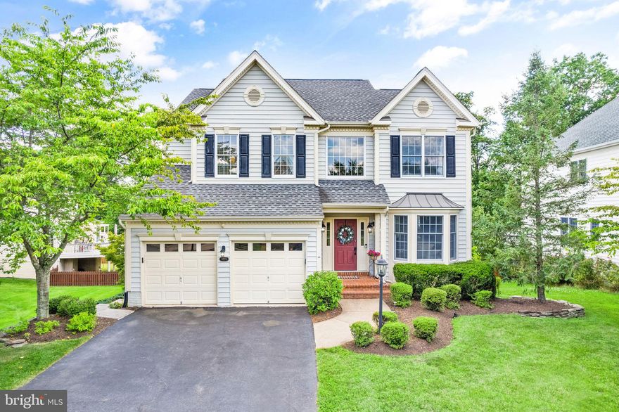 *** New Dishwasher being  installed 07/17/2023 ***Welcome to this beautiful colonial-style home located in the sought after gated community of Dominion Valley Country Club . This home offers an abundance of space and luxurious features with an updated feel. Step inside to  the bright and airy two-story foyer, a gourmet kitchen equipped with sleek stainless steel appliances,  quartz countertops, and sun filled eat in kitchen area. The family room with  cozy fireplace and brick surround creates a warm and inviting atmosphere. Hardwood floors flow throughout most of the main level, adding elegance and charm. The main level also includes a convenient mudroom/laundry area, a spacious living room, and a formal dining room, perfect for entertaining guests and hosting memorable gatherings. Upstairs, you'll find four generously sized bedrooms with large closets and two full bathrooms. The expansive primary bedroom boasts an oversized walk-in closet, trey ceiling and a luxurious en-suite bathroom. The upper level hallway bath features double sinks. The basement has a full size 5th bedroom and double sink full bath. The large rec. room and secondary area provide endless possibilities for in law suite/au pair suite, office, or kids play area.   Outside, the flat and fully fenced backyard offers privacy and tranquility, enhanced by a spacious deck and underneath patio for perfect for outdoor dining and relaxation. Large open space behind the property that will never be changed and offers privacy and greenery!  Don't miss the opportunity to own this beautiful colonial home in award winning DVCC  where luxury, space, and convenience blend harmoniously. Located within minutes of shopping, schools, restaurants and commuting options. Welcome Home!